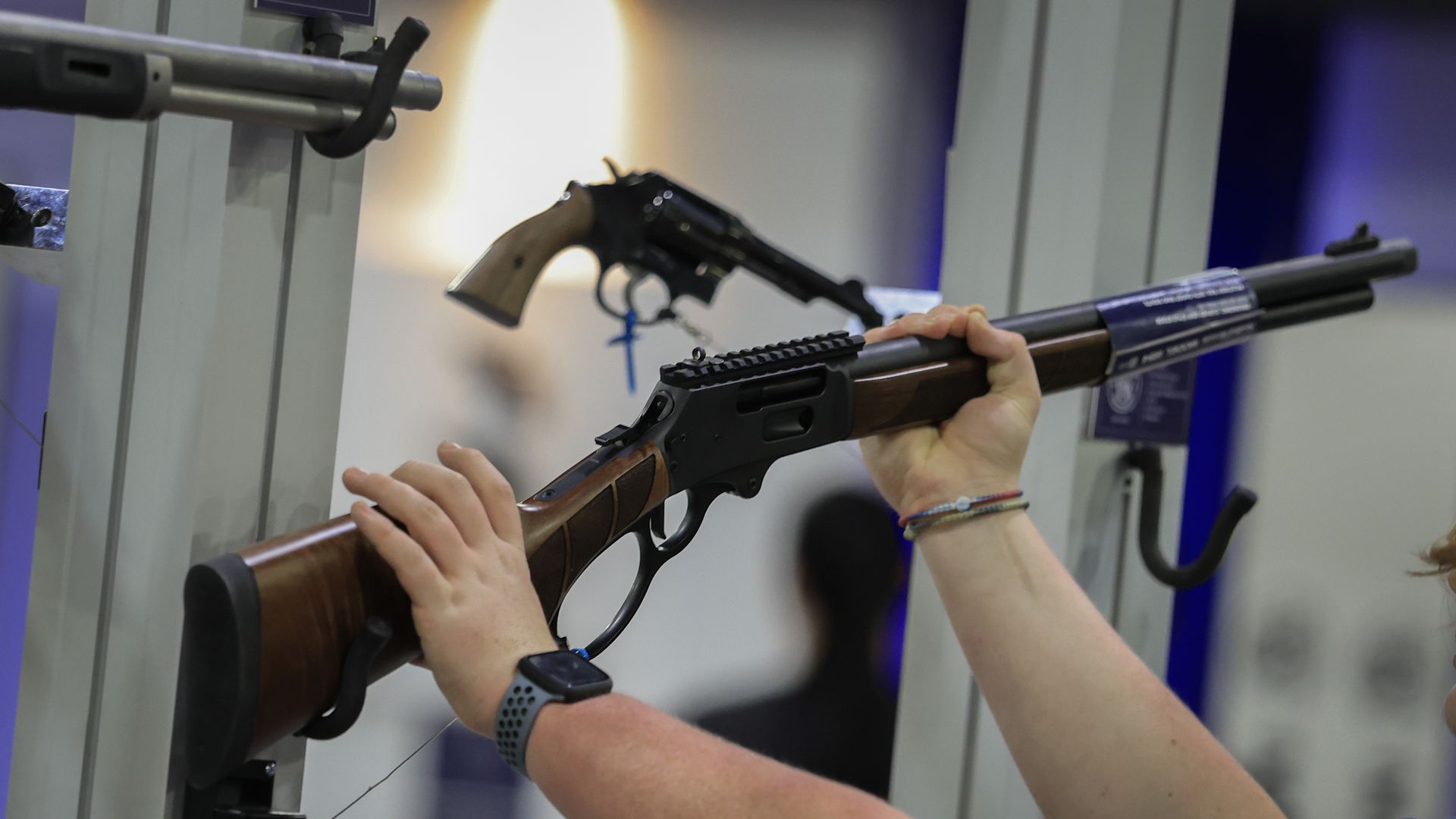  A visitor looks at a rifle in the Smith & Wesson booth during the 2025 NRA Annual Meetings & Exhibits held in the Georgia World Congress Center on April 26, 2025 in Atlanta, Georgia. 