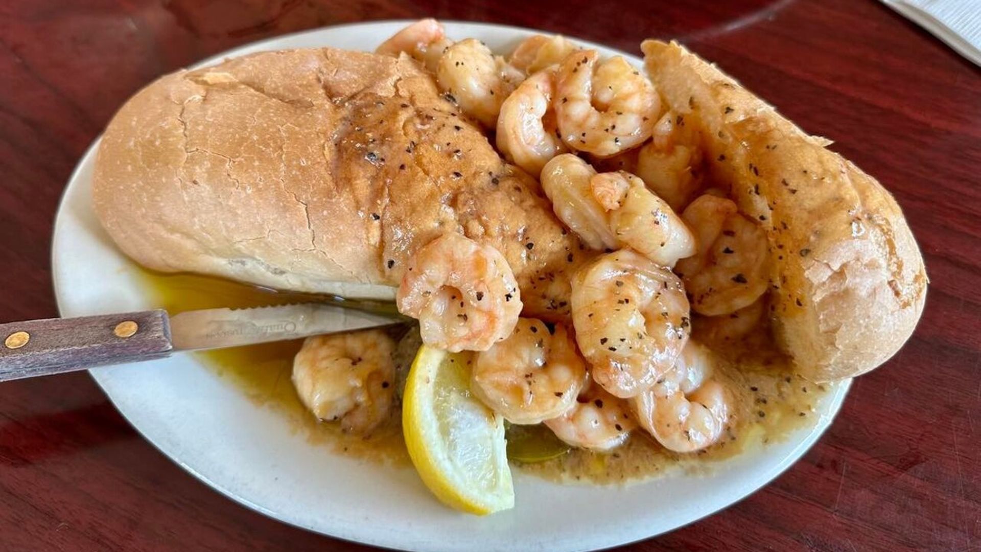 Photo shows bbq shrimp in a poboy.