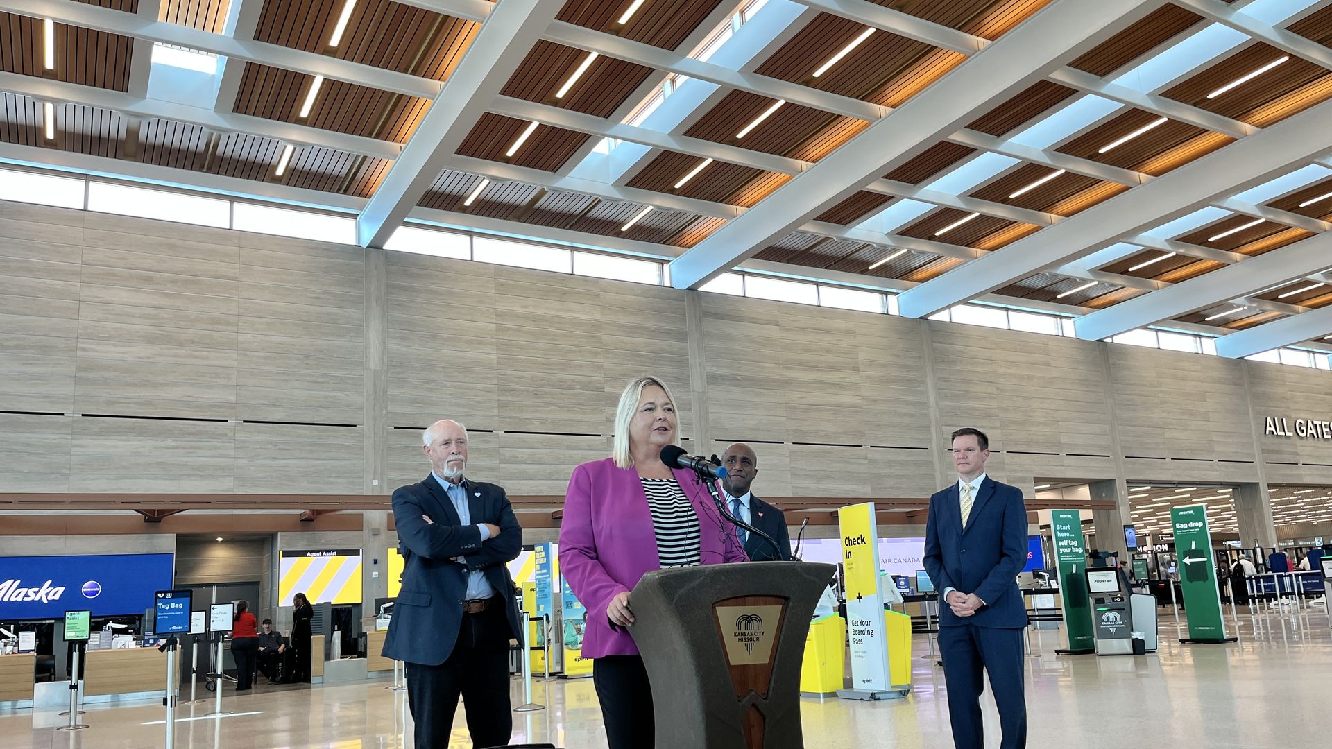 KC Aviation Director Melissa Cooper addresses reporters at the check-in public area of the KCI terminal.