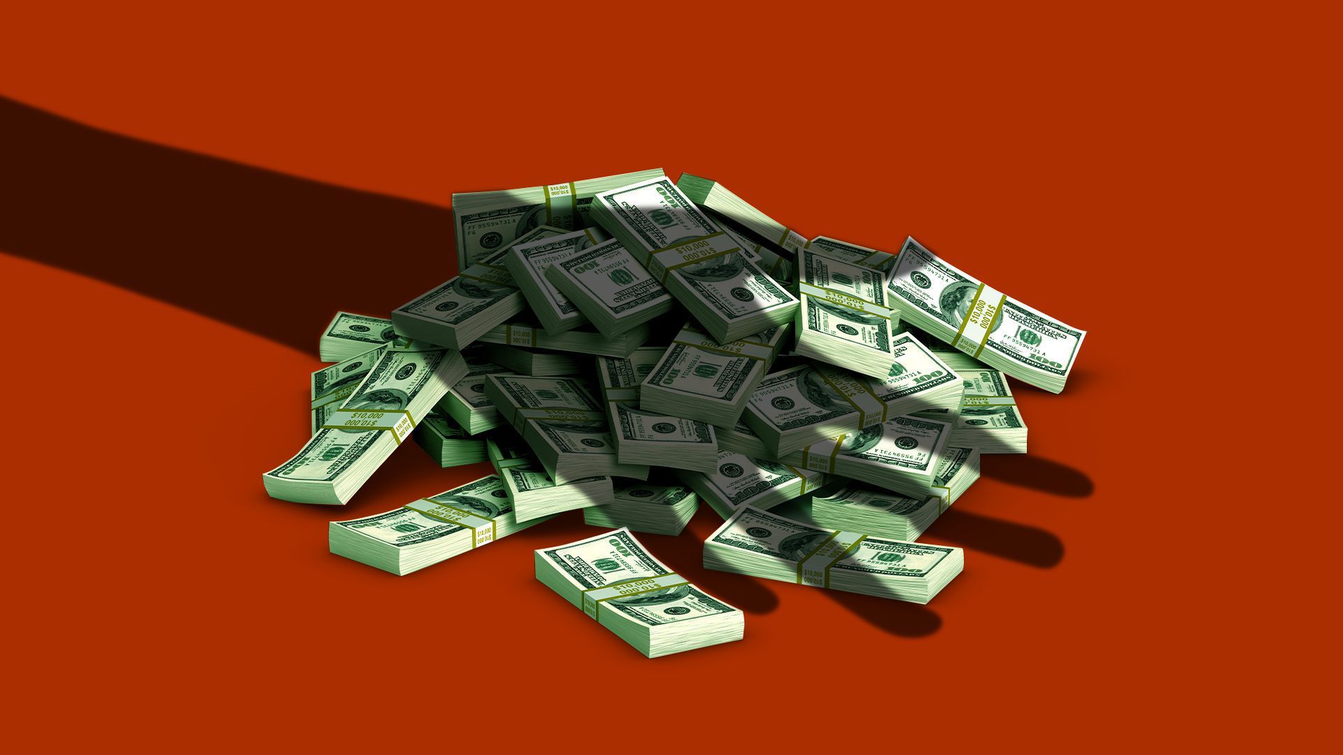The shadow of a hand over a pile of green currency against a red background.