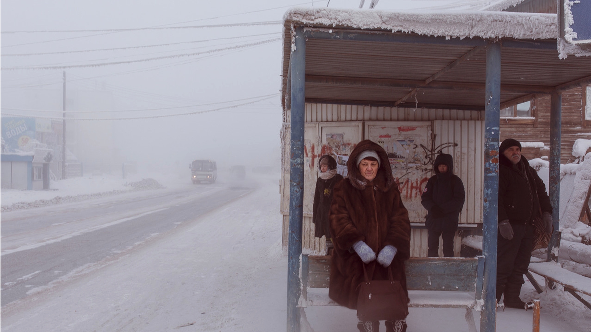 Photo of people waiting for the bus in the snow
