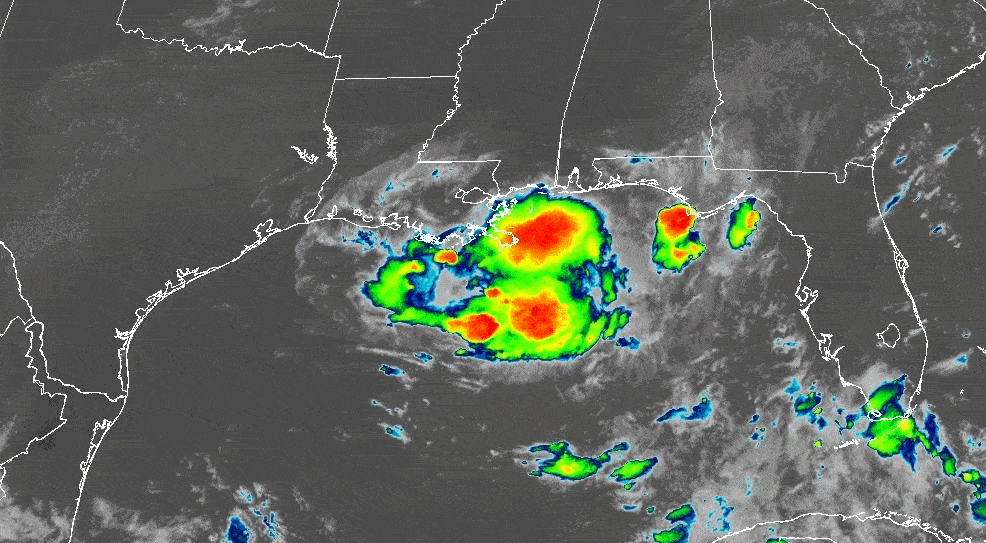 Satellite radar image of a storm system in the Gulf of Mexico with bright red, yellow, and green areas indicating intense weather activity near the coastlines of Texas, Louisiana, Mississippi, Alabama, and Florida.