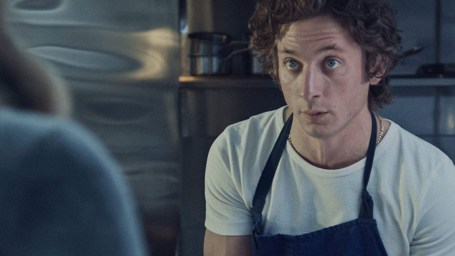 guy in t shirt and apron 