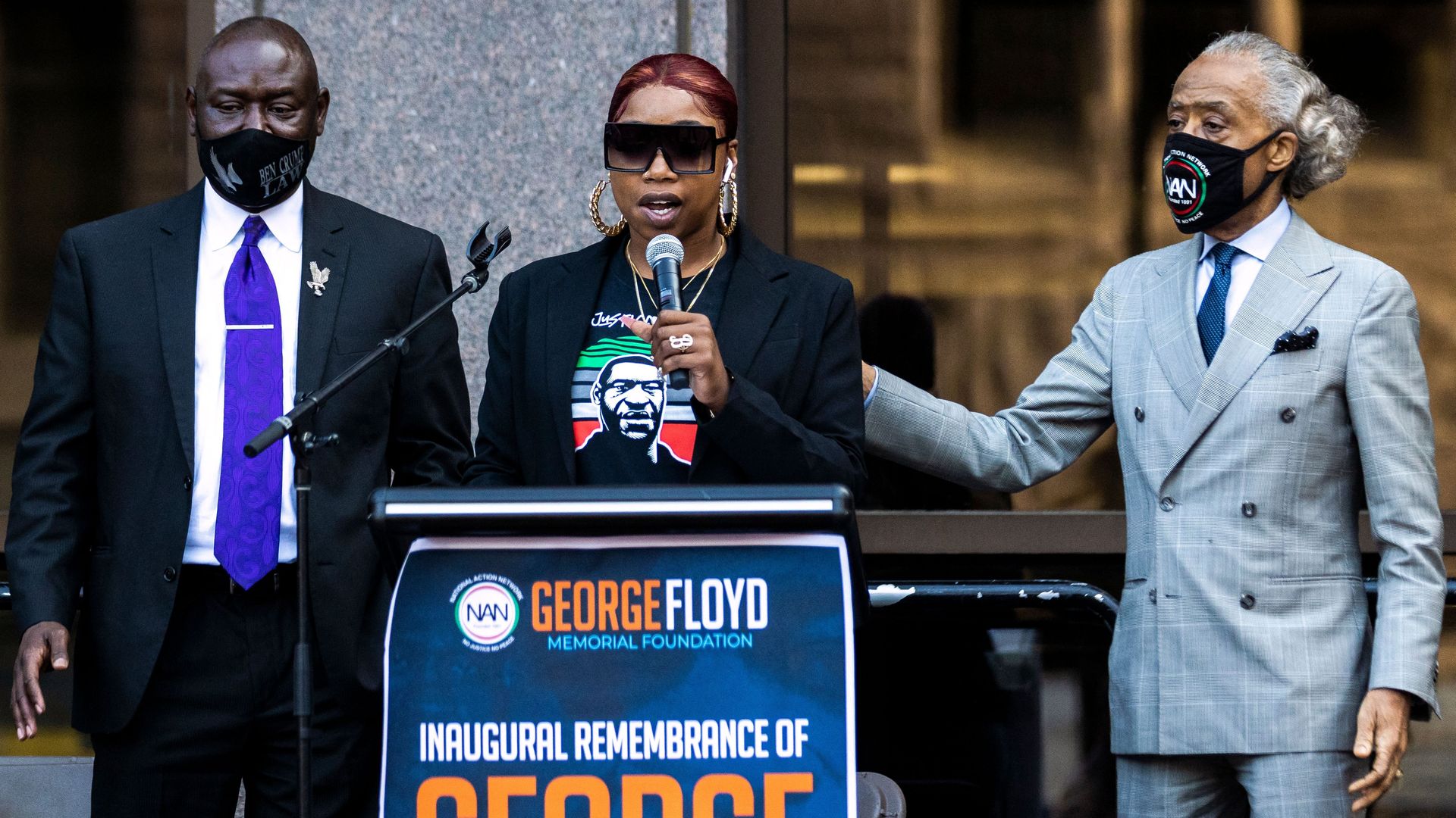 Ben Crump and Bridgett Floyd stand behind a podium