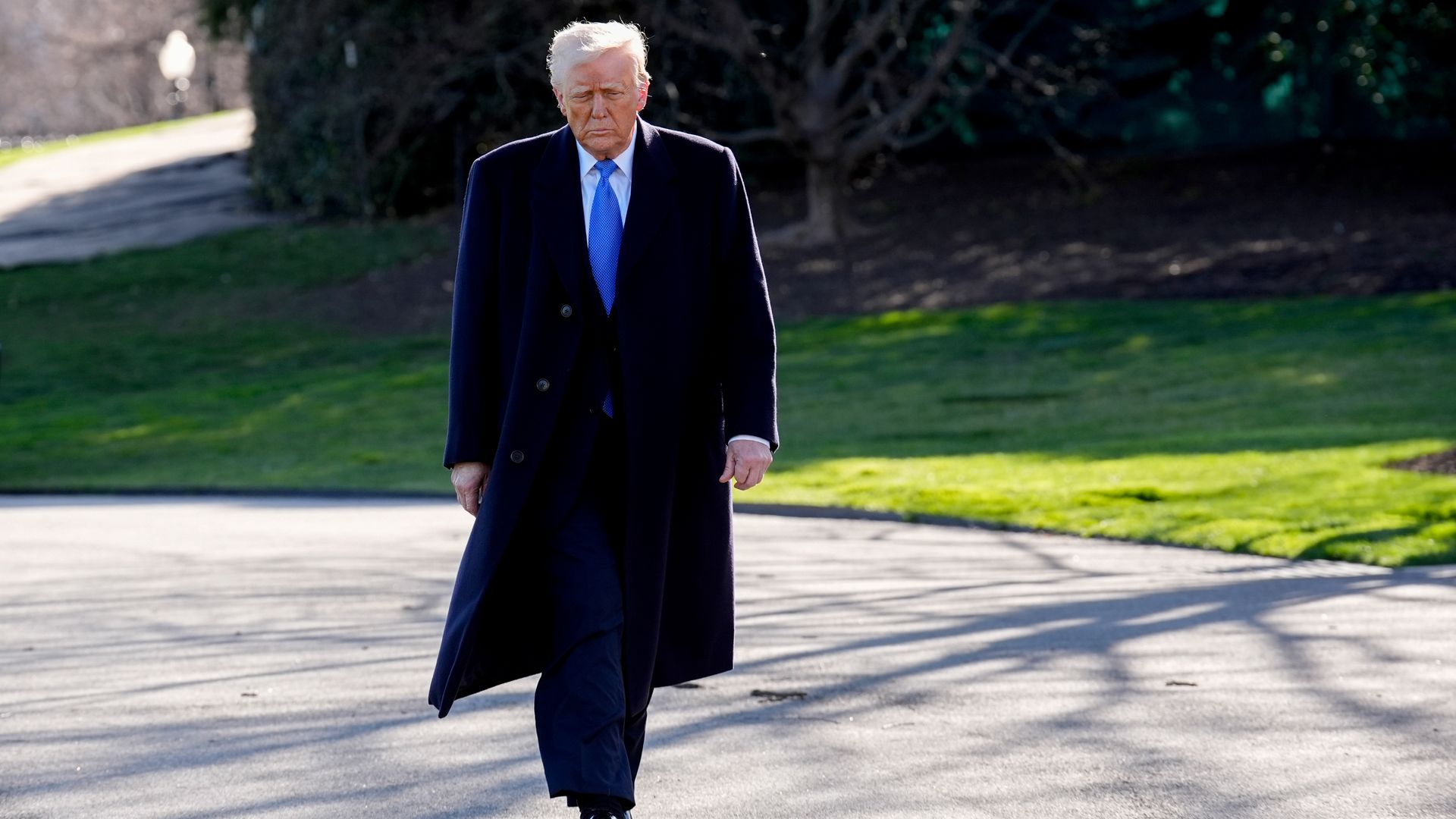 Trump walks near White House lawn