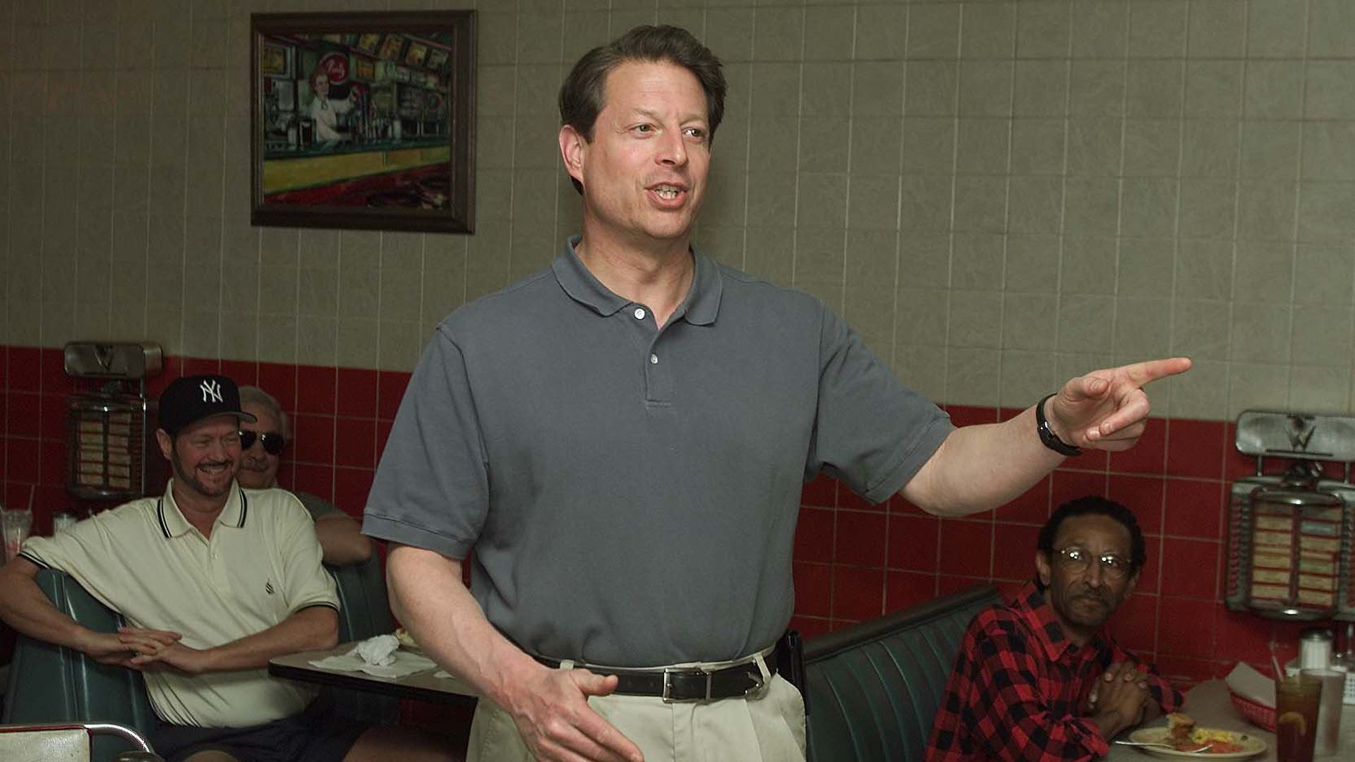 Al Gore speaking in a diner setting.