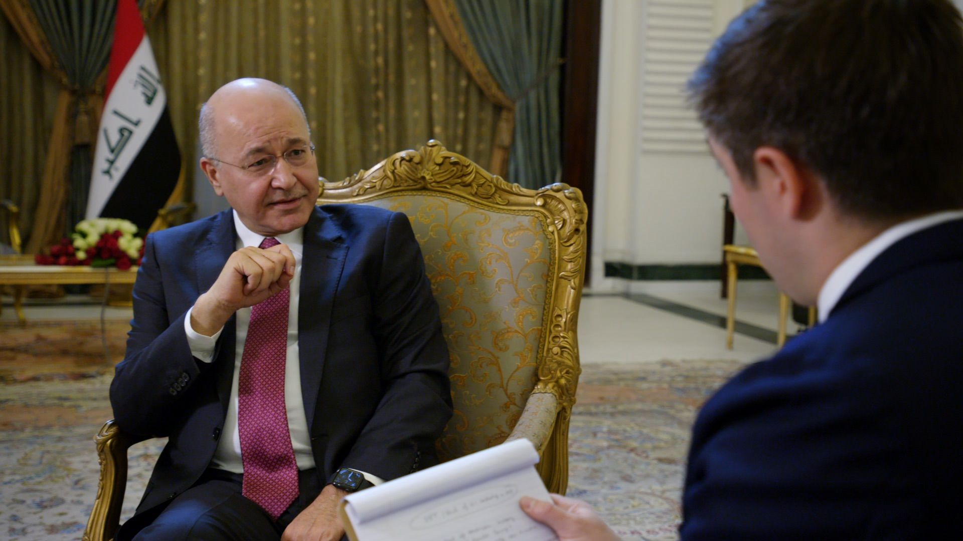 Iraqi President Barham Salih gestures as he gives an interview
