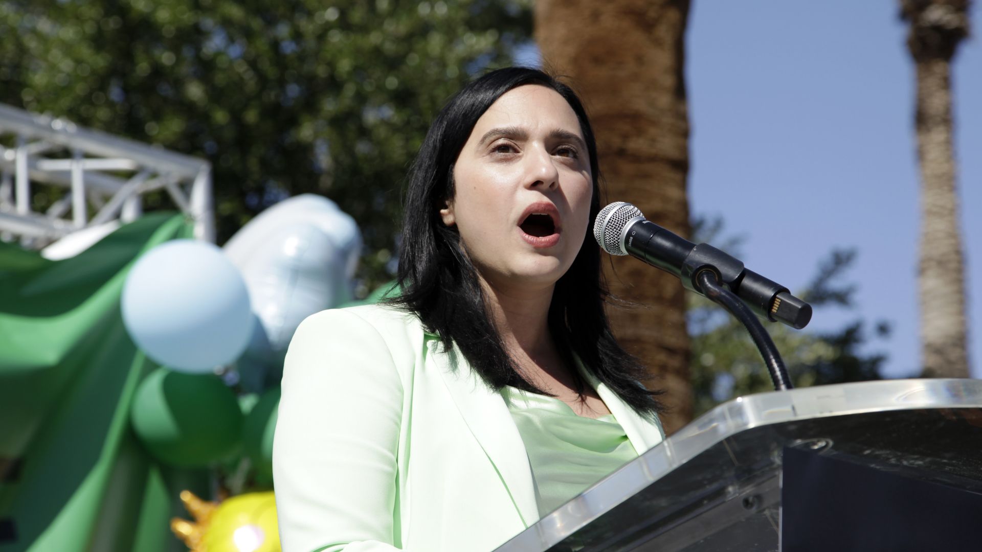 A woman at a podium.