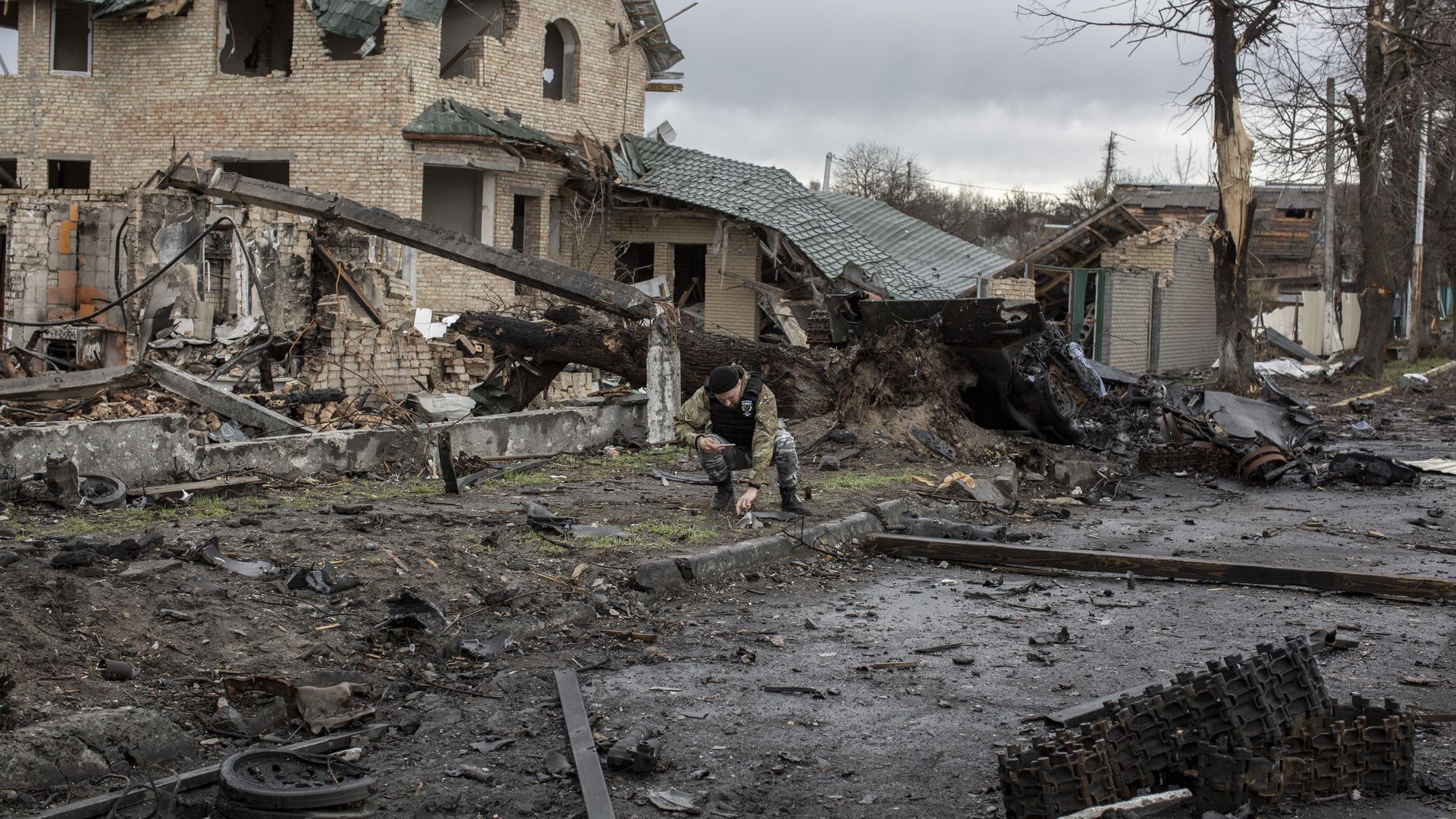 A Ukrainian inspecting the remains of Russian military vehicles in Bucha, Ukraine, on April 8.