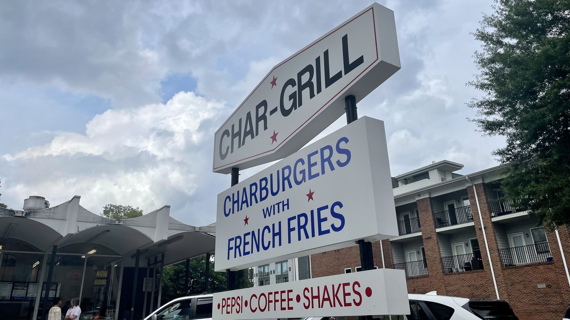 A sign for the restaurant Char-Grill in downtown Raleigh that advertises cheeseburgers with fries. 