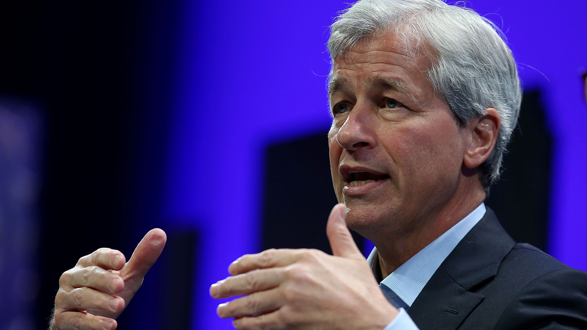J.P. Morgan CEO Jamie Dimon gesturing in front of a crowd.