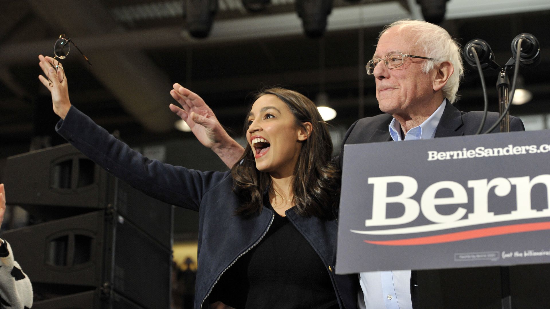 AOC and Bernie Sanders at a campaign event