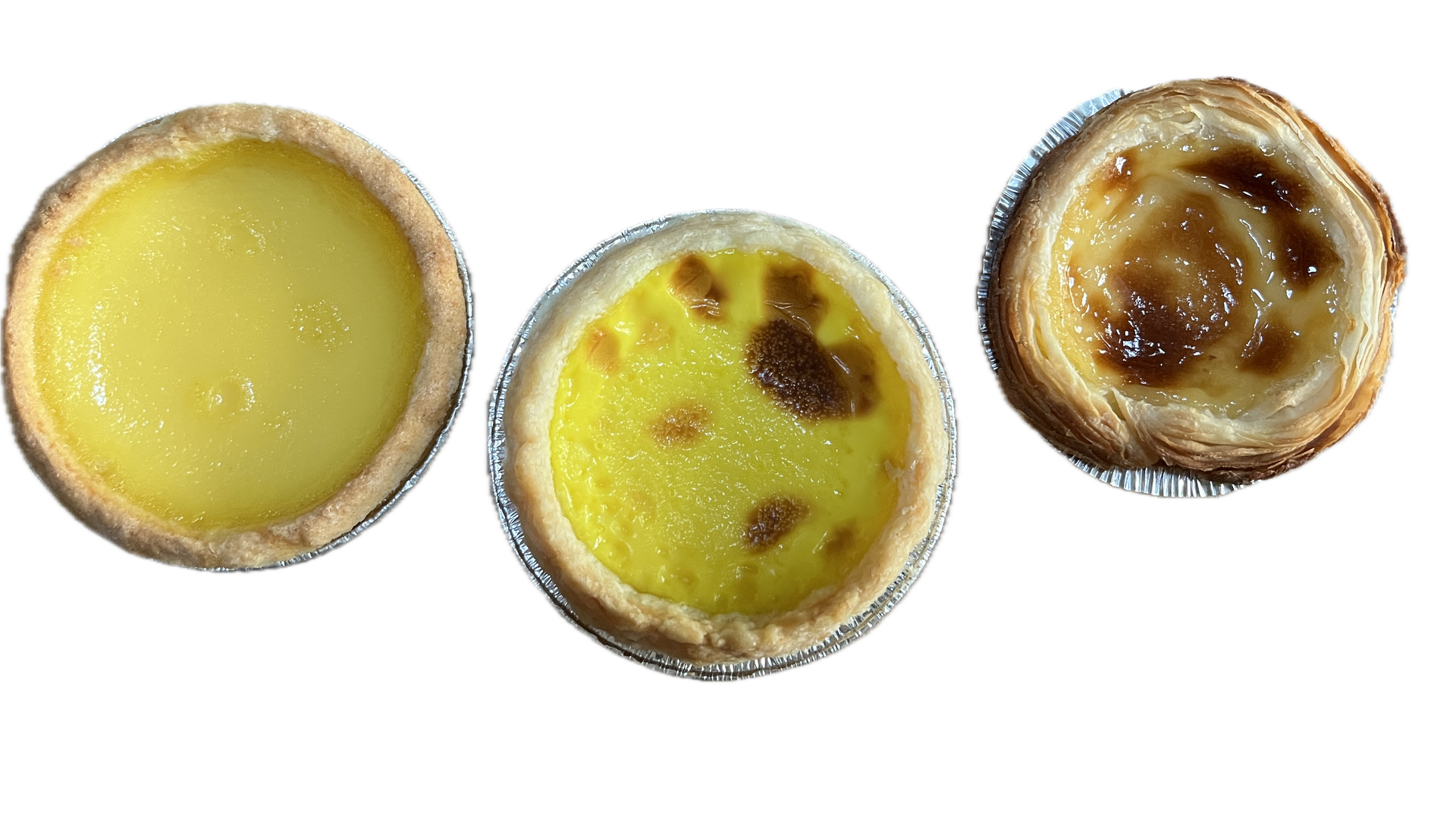 Three custard tarts in foil cups on a black background: a smooth yellow tart, a yellow tart with browned spots, and a caramelized custard tart with flaky crust.