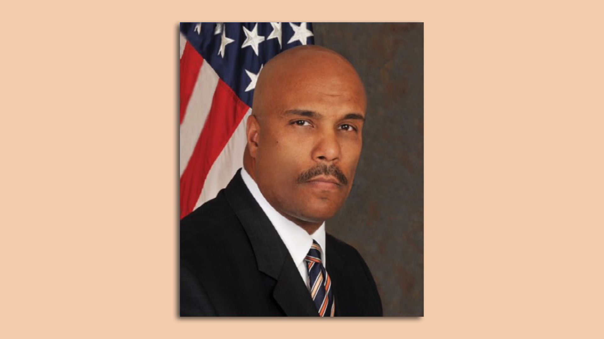 A portrait of Robert Clark, the new Columbus director of public safety, in front of an American flag.