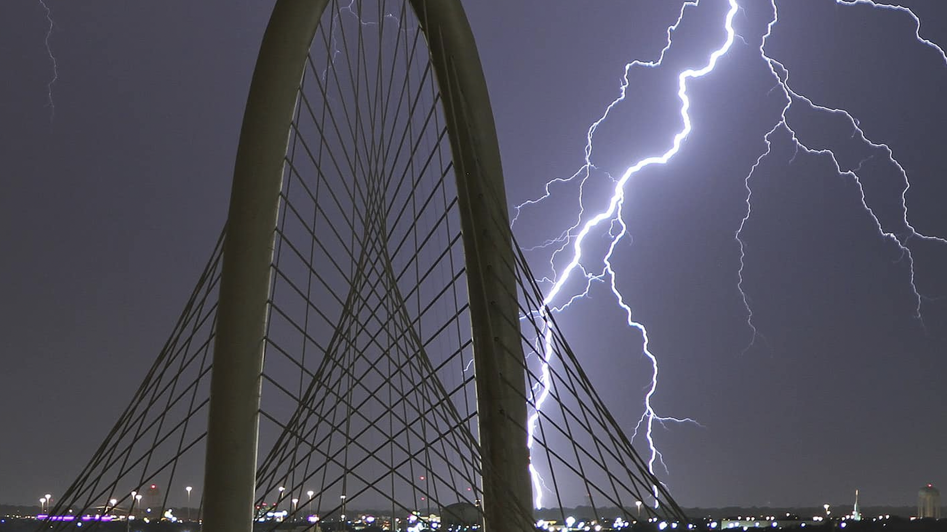 Lightning behind a bridge