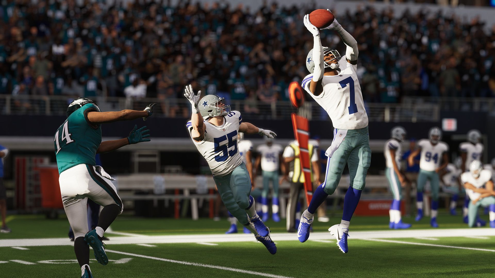 Video game screenshot of a football player catching a pass