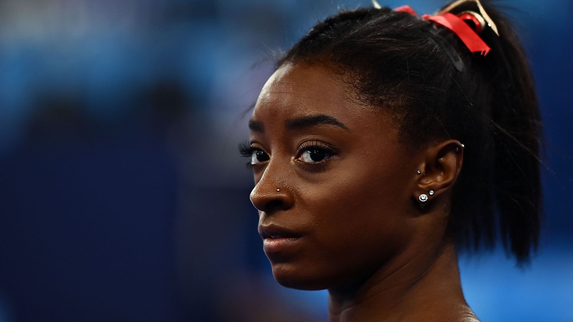 Simone Biles gets ready to compete in the uneven bars event of the artistic gymnastics women's qualification during the Tokyo 2020 Olympic Games at the Ariake Gymnastics Centre in Tokyo on July 25