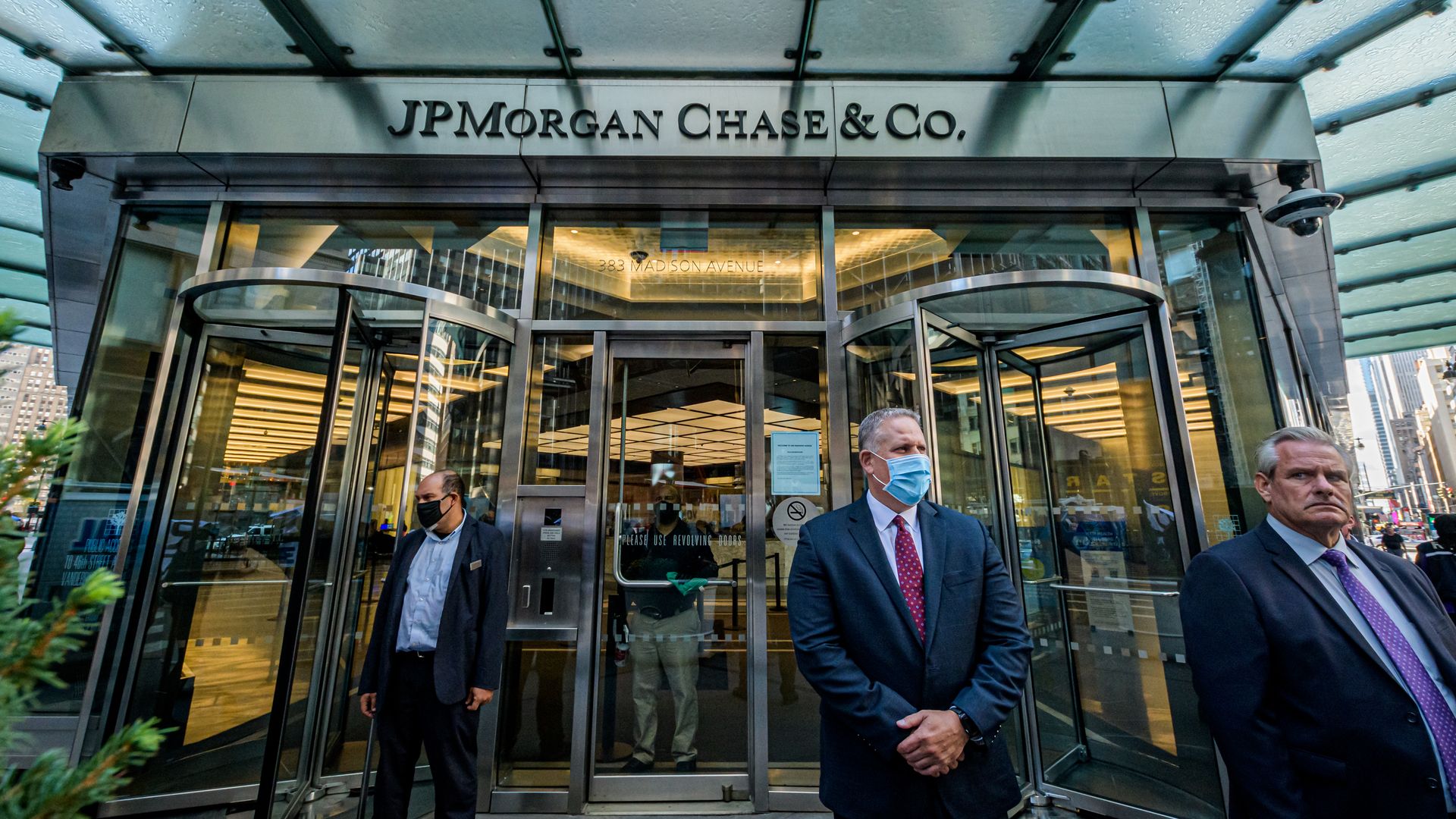 Men in masks standing outside JPMorgan