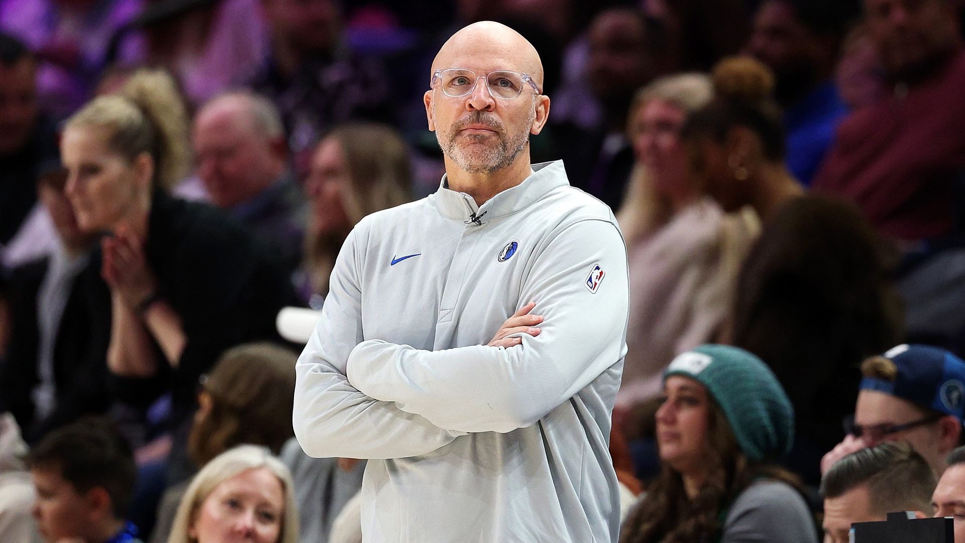 Jason Kidd crosses his arms and looks up during a game