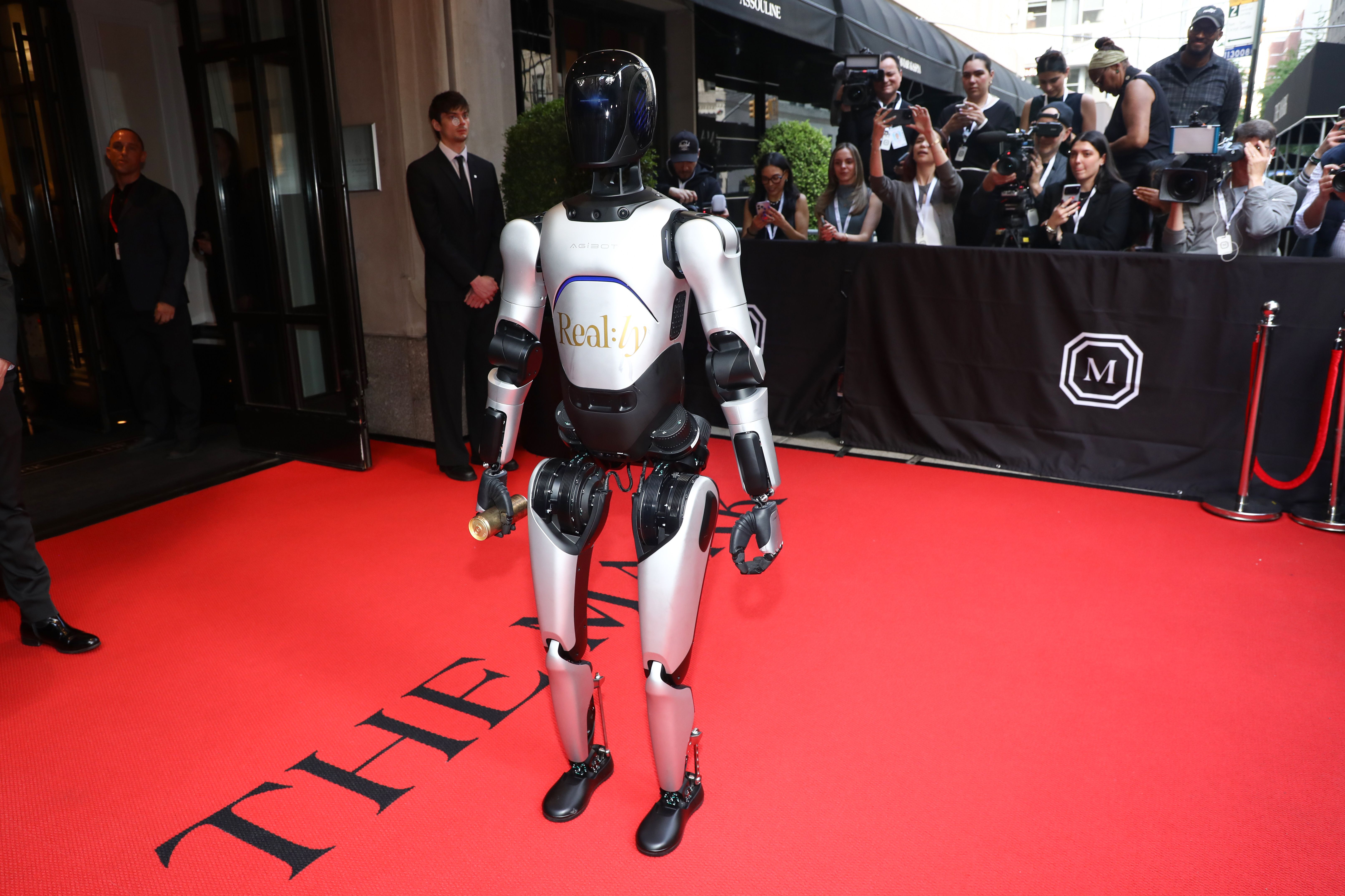 A humanoid robot departs The Mark hotel en route the Met Gala in Manhattan last night. Photo: Andy Kropa/Invision/AP