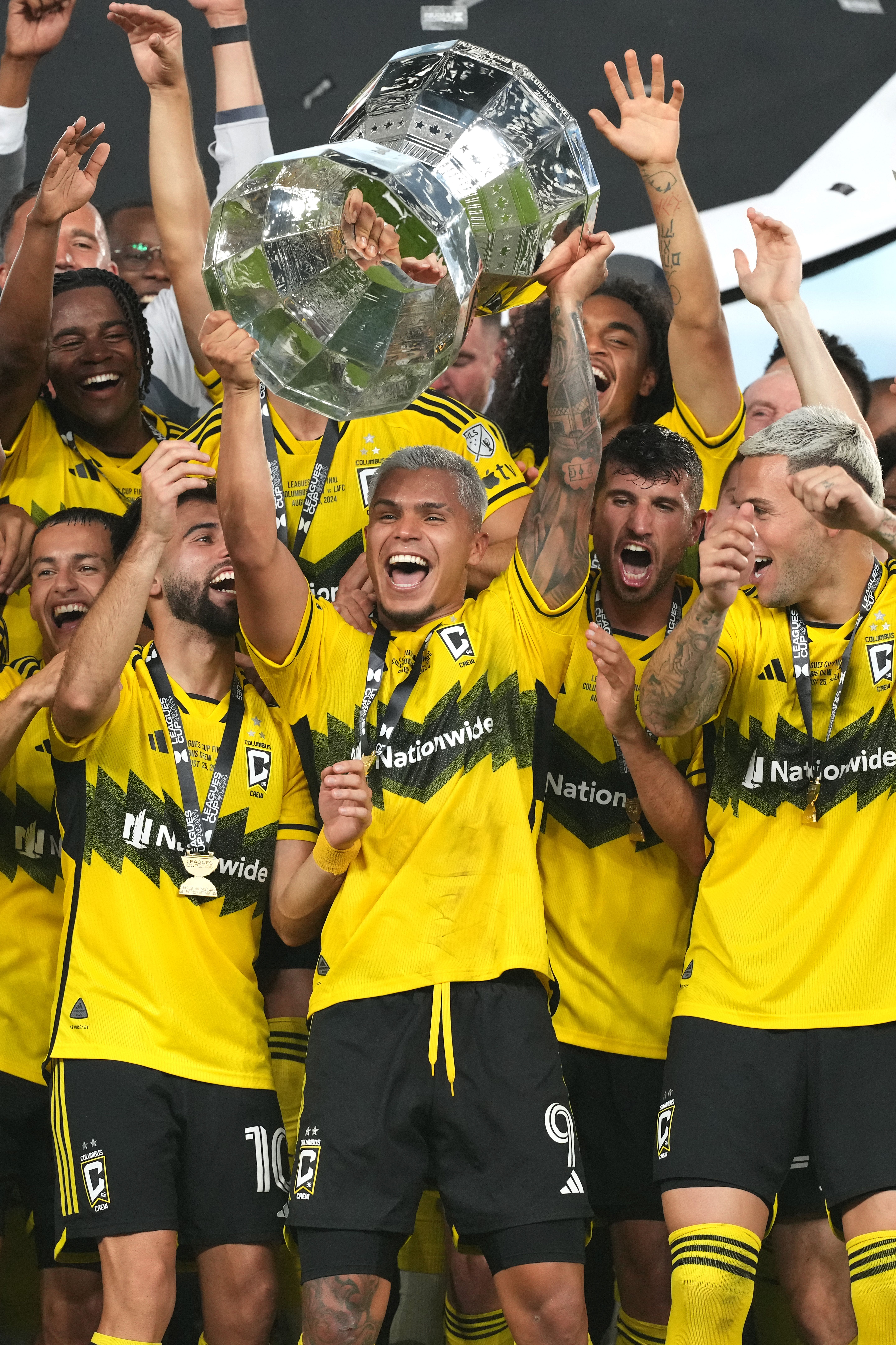Cucho Hernandez and Crew players hoiost the Leagues Cup trophy