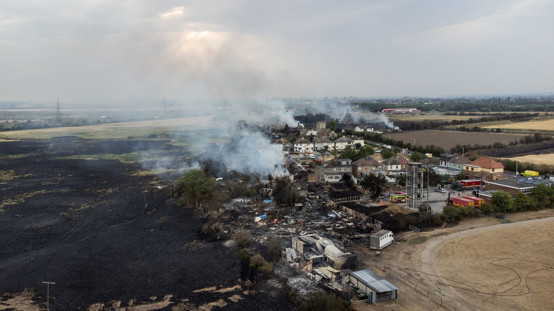 Smoke from fires in a residential area in Wennington, England, on July 19.