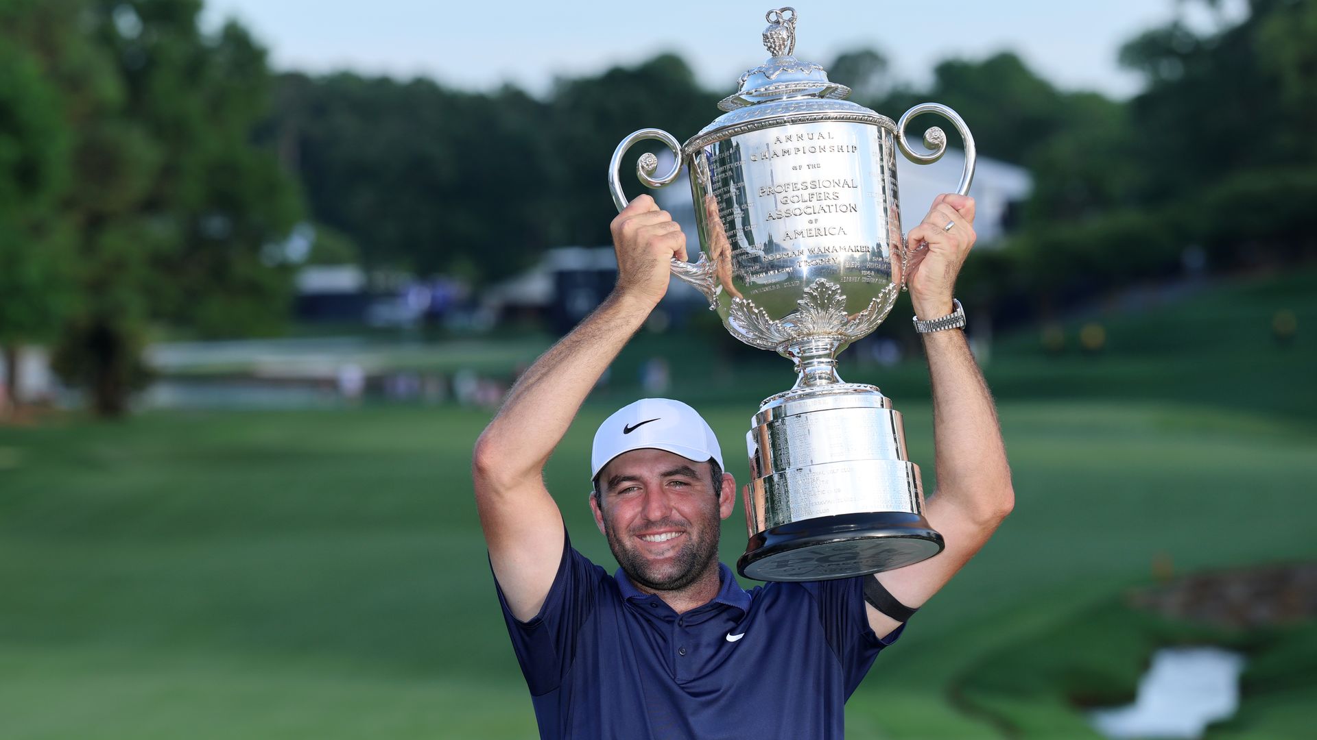 Scottie Scheffler of the United States holds the Wanamaker Trophy aloft following his victory during the final round of the PGA Championship at Quail Hollow Country Club on May 18, 2025 in Charlotte, North Carolina. (Photo by David Cannon/Getty Images)