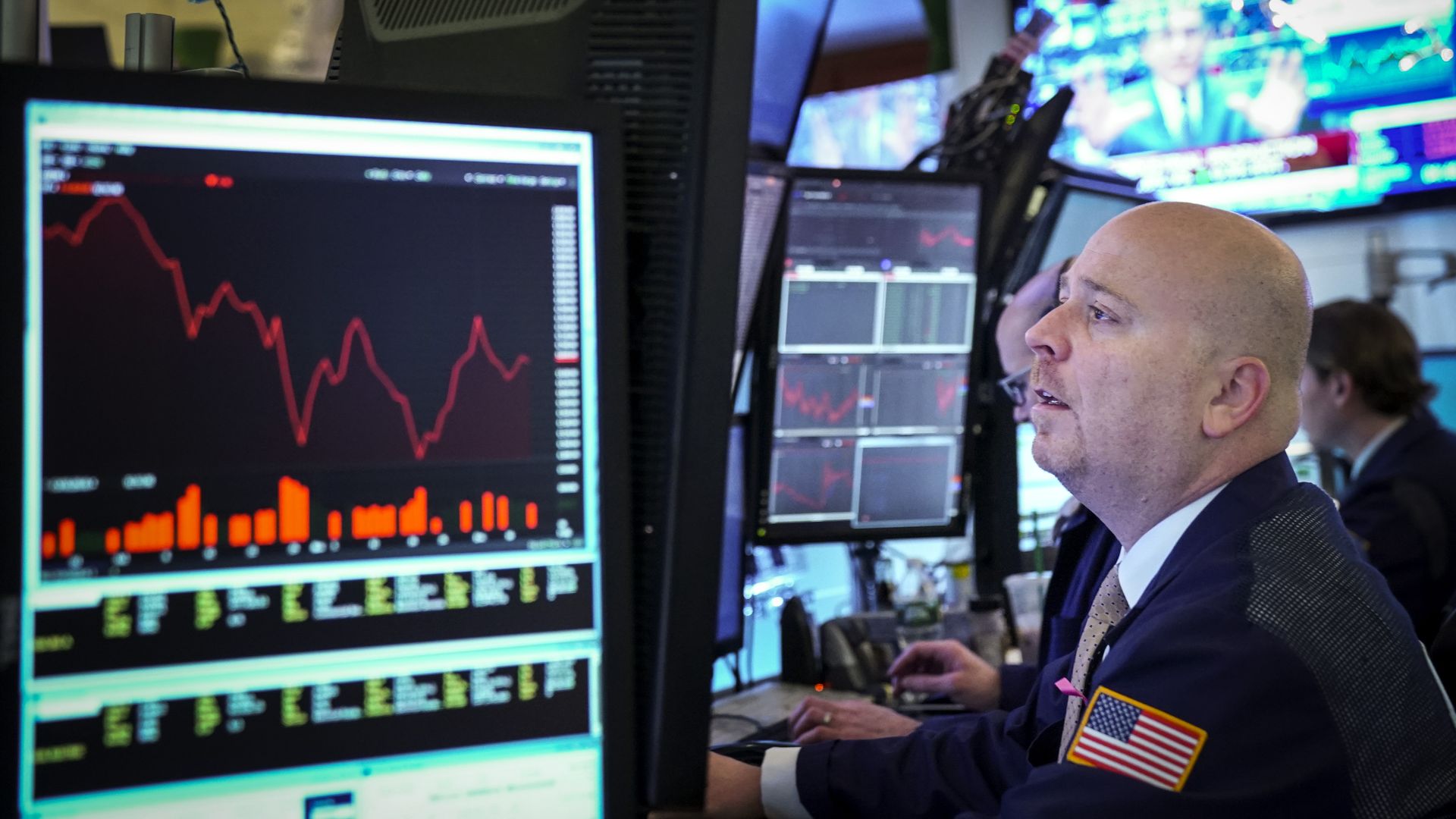 Stock trader looking at screen