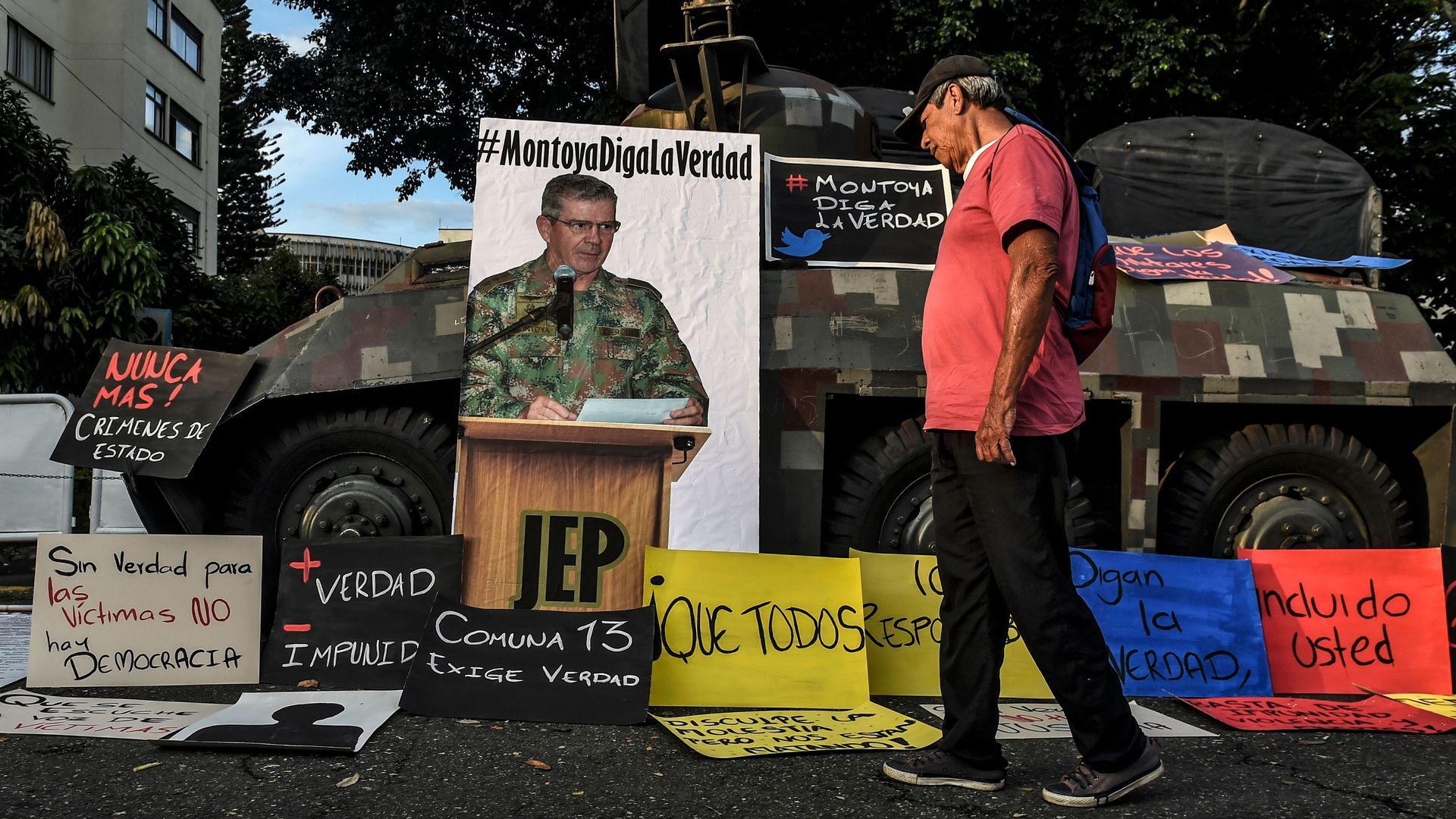 A protest in 2018 outside an army barracks accusing Colombian army Gen. Mario Montoya of covering up more than 100 extrajudicial killings