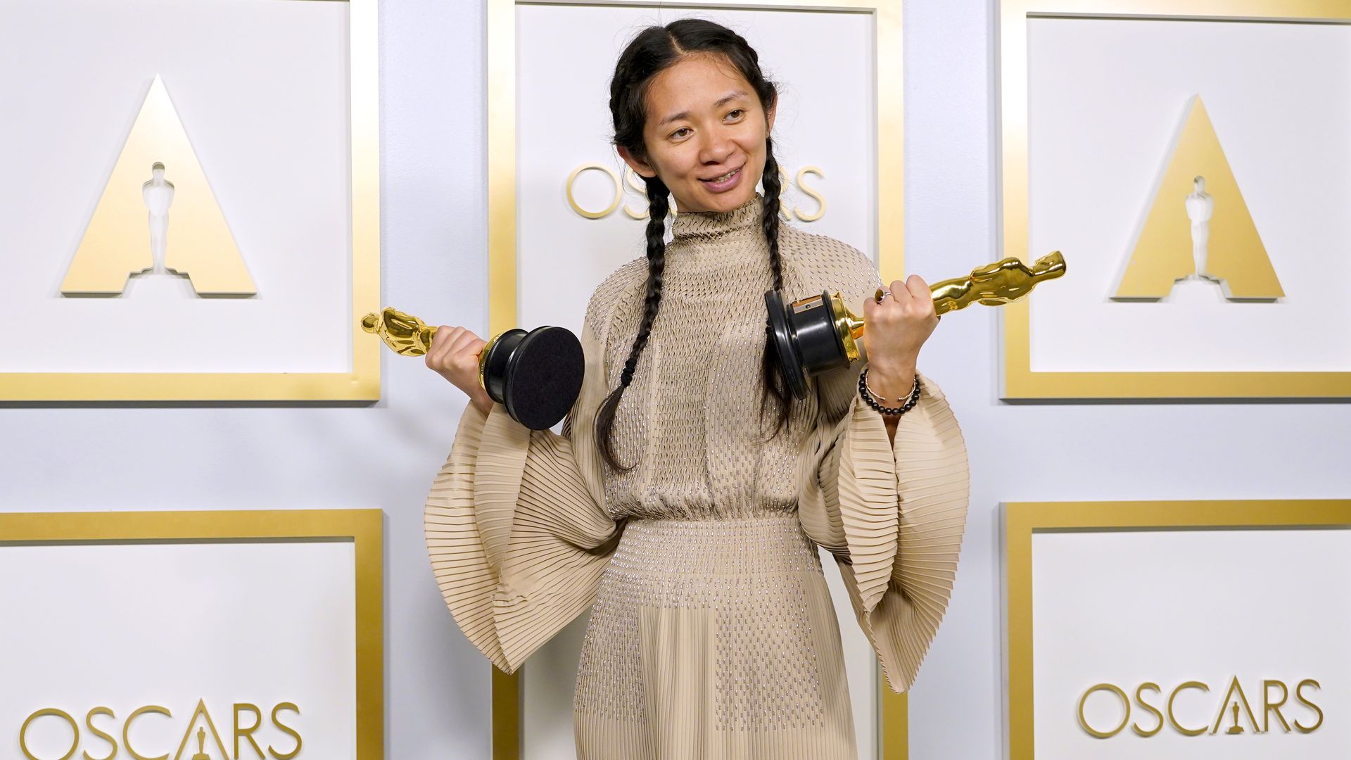   Director/Producer Chloe Zhao, winner of Best Directing and Best Picture for "Nomadland," poses in the press room at the Oscars on Sunday, April 25, 2021, at Union Station in Los Angeles.