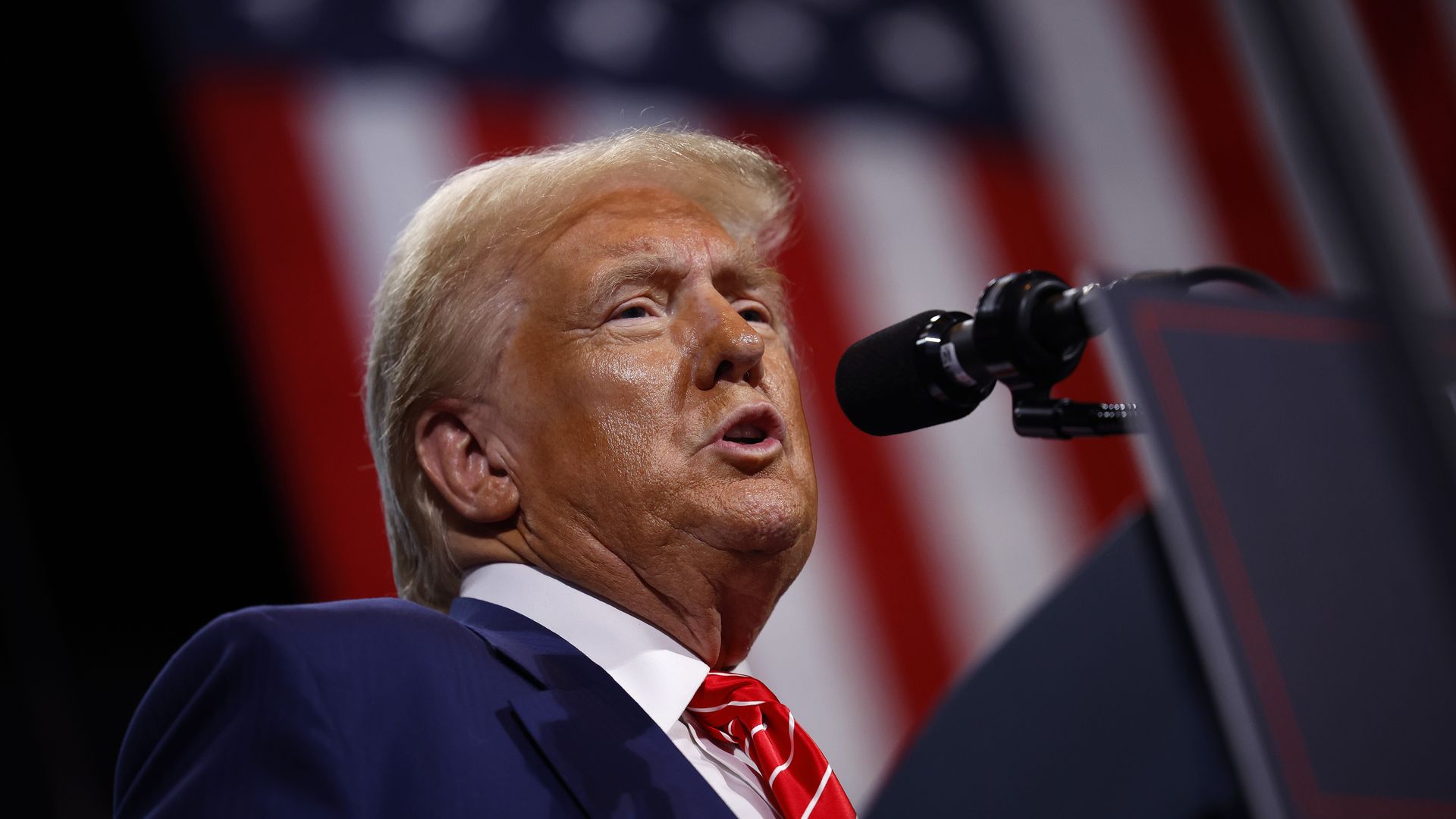 Republican presidential nominee, former U.S. President Donald Trump delivers remarks during a campaign rally at the Cobb Energy Performing Arts Centre on October 15, 2024 in Atlanta, Georgia.