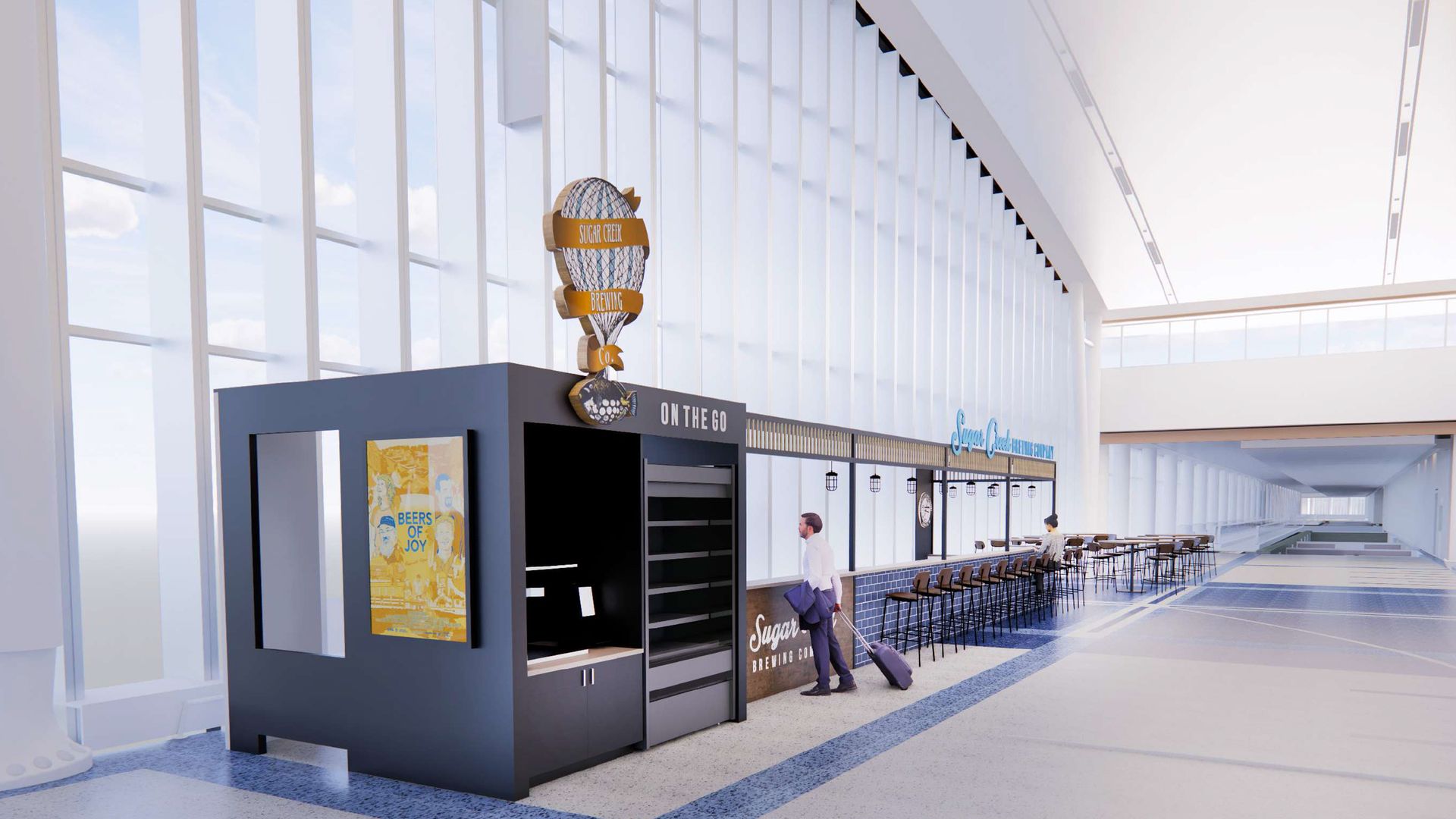 Modern indoor space with large windows and a small black kiosk labeled Sugar Creek Brewing Co. and On The Go. A man with a suitcase stands near a blue and wood long counter with chairs.