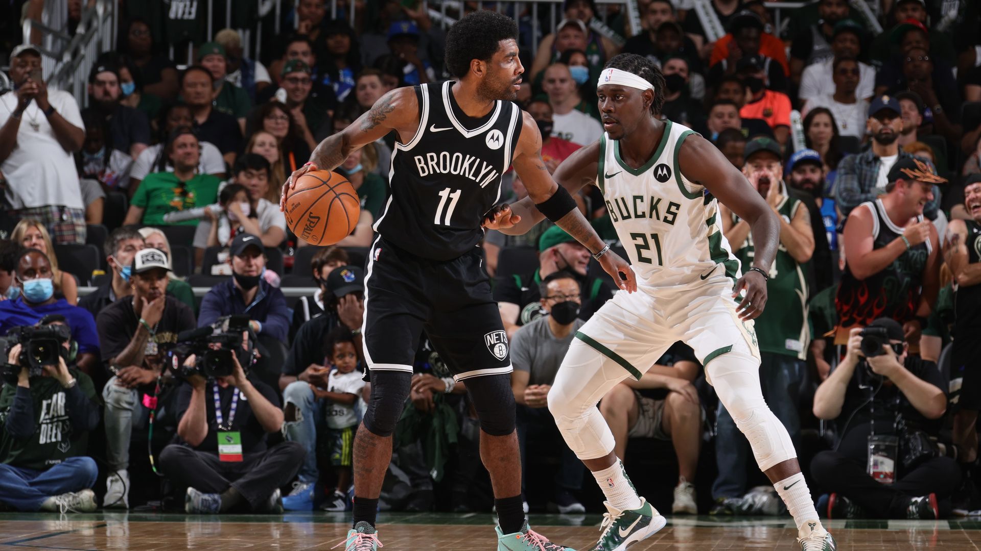 Kyrie Irving playing against Jrue Holiday. 