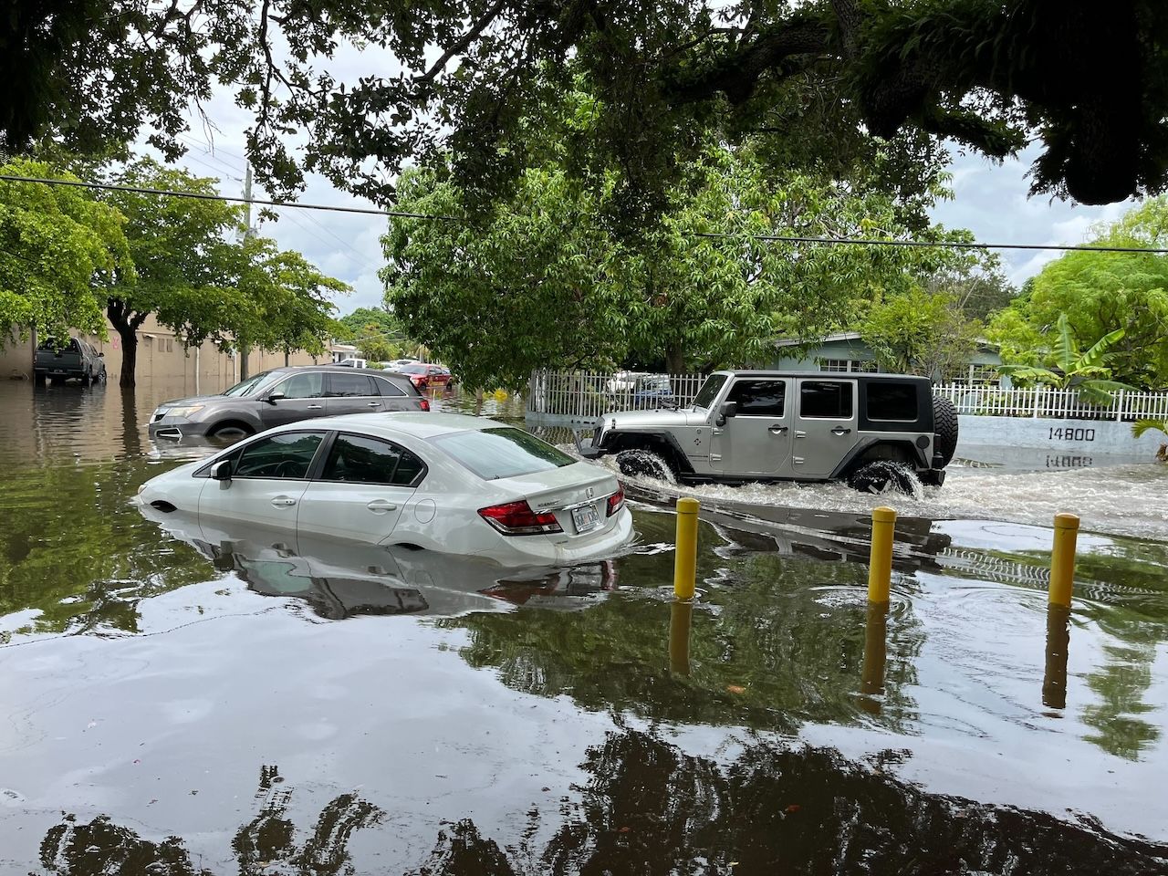 Flood waters on a residential street in North Miami Dade had yet to recede as of Thursday.