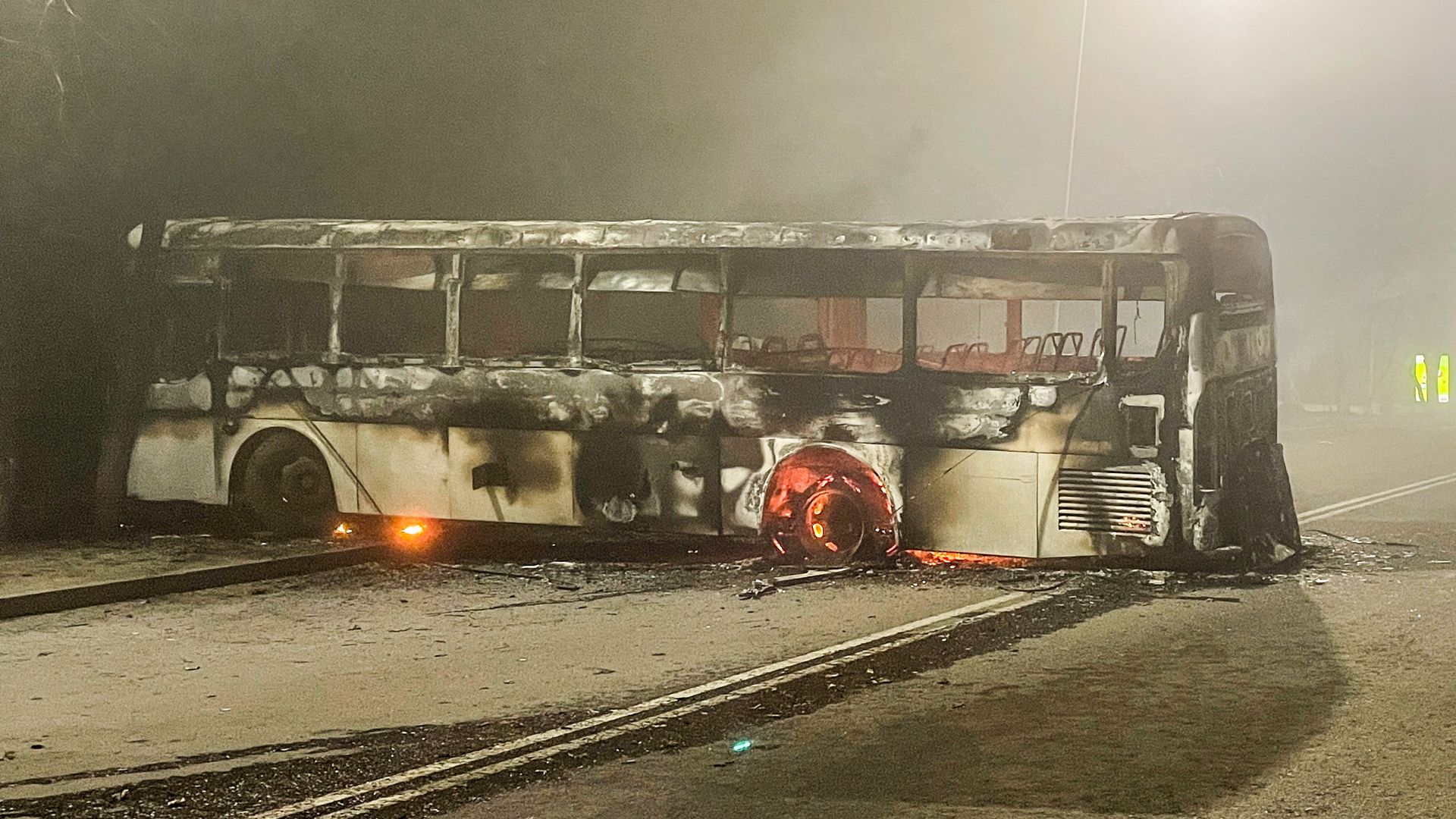 A burnt bus is seen by the Almaty mayors office. Photo: Valery Sharifulin/TASS via Getty Images