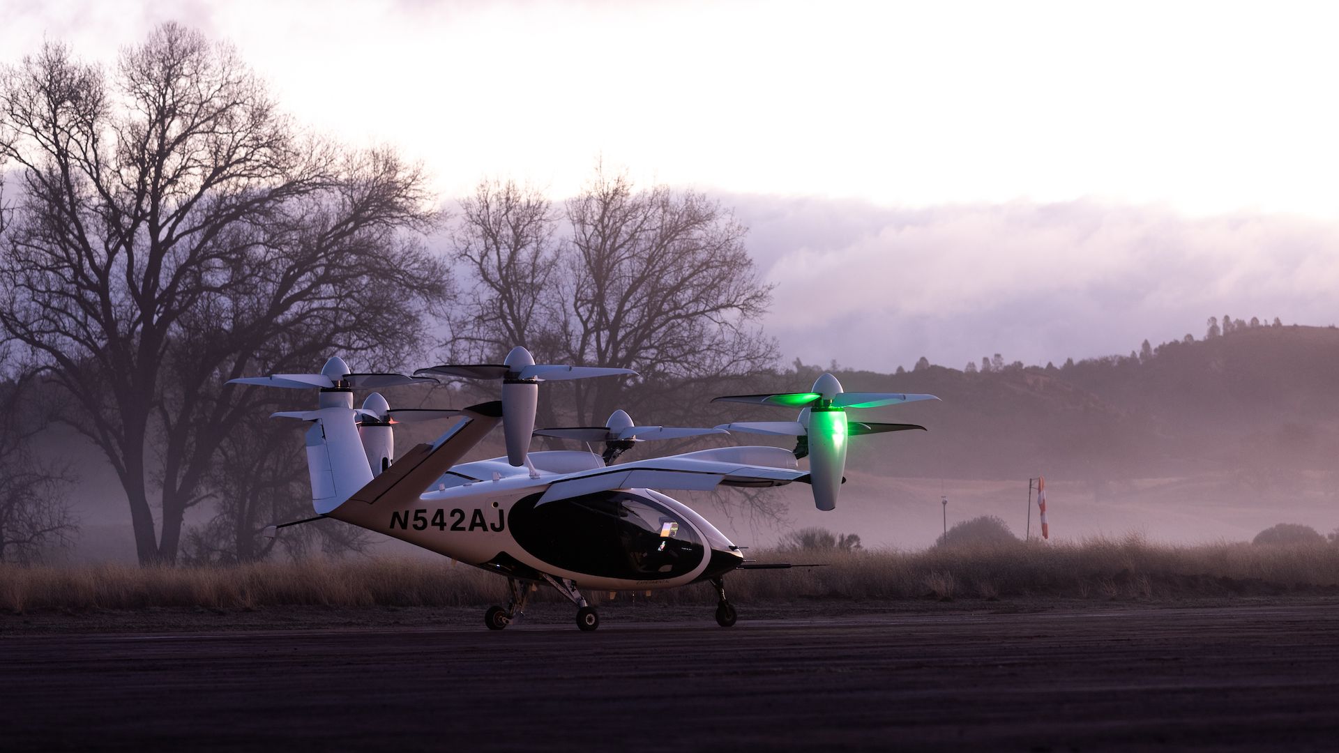 Joby electric air taxi sitting at an airfield.