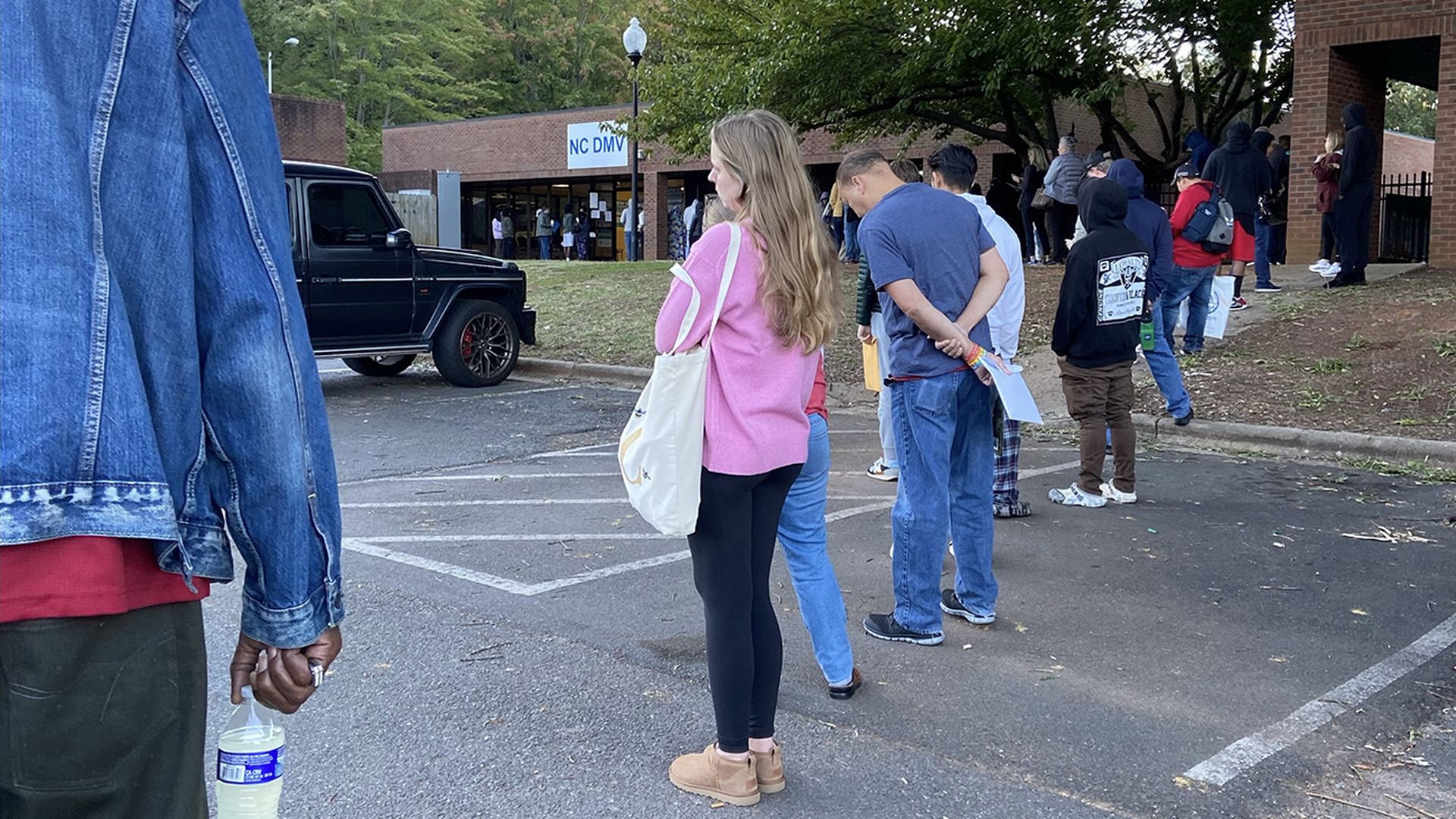 long line of people waiting outside the DMV