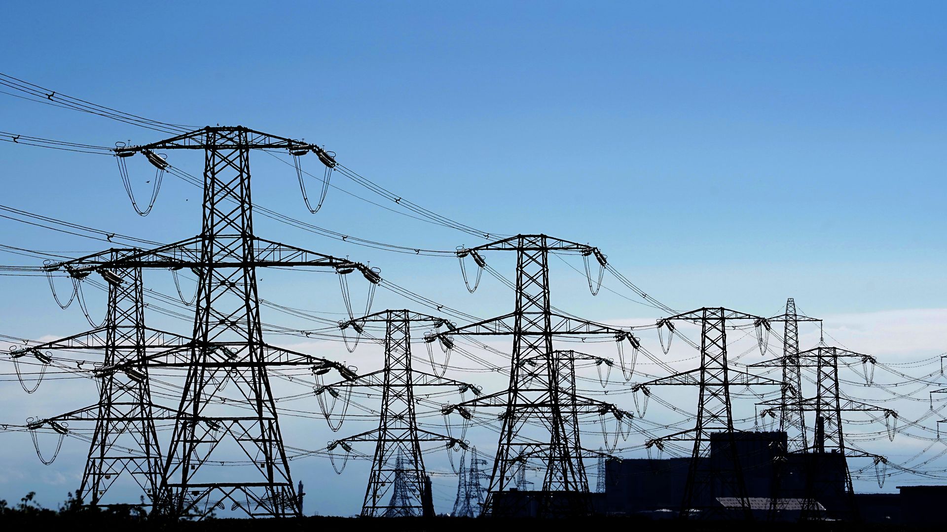 Electricity pylons run across Romney Marsh in Kent from Dungeness nuclear power station