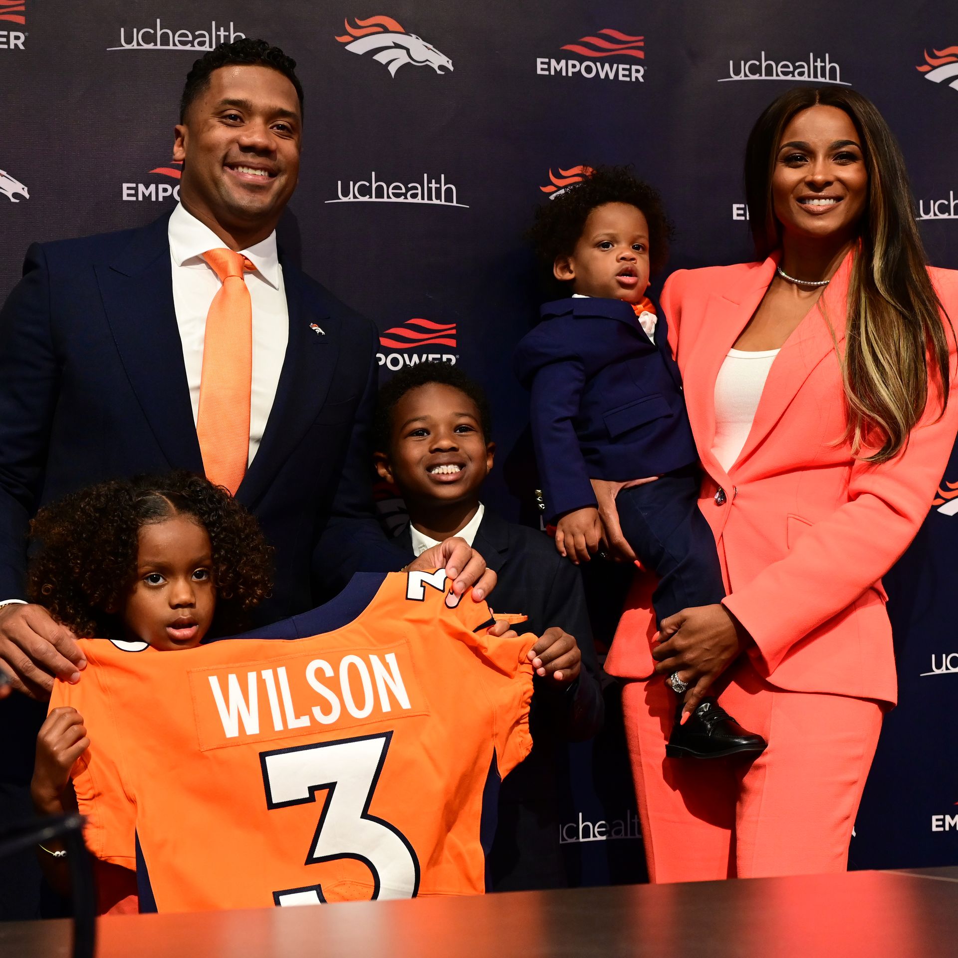 Quarterback Russell Wilson is introduced at Denver Broncos Headquarters in Englewood, Colorado on Wednesday, March 16. Also pictured are his wife Ciara, right, children.