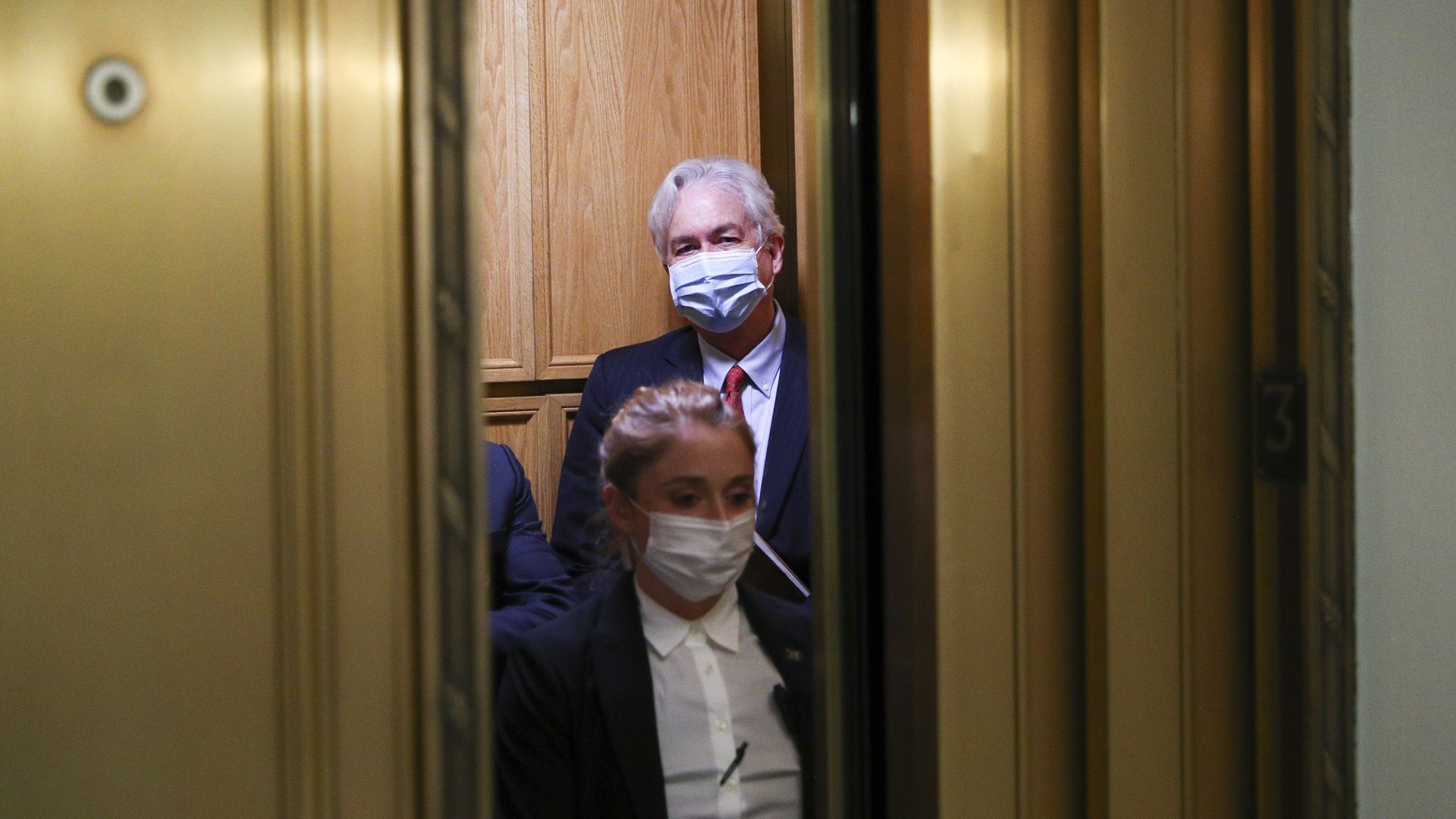 Burns departs his confirmation hearing. 