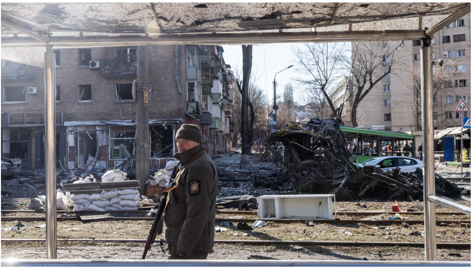  A Ukrainian soldier stands among debris from a damaged residential apartment block after a Russian rocket was shot down by Ukrainian air defences in Kyiv on March 14. 