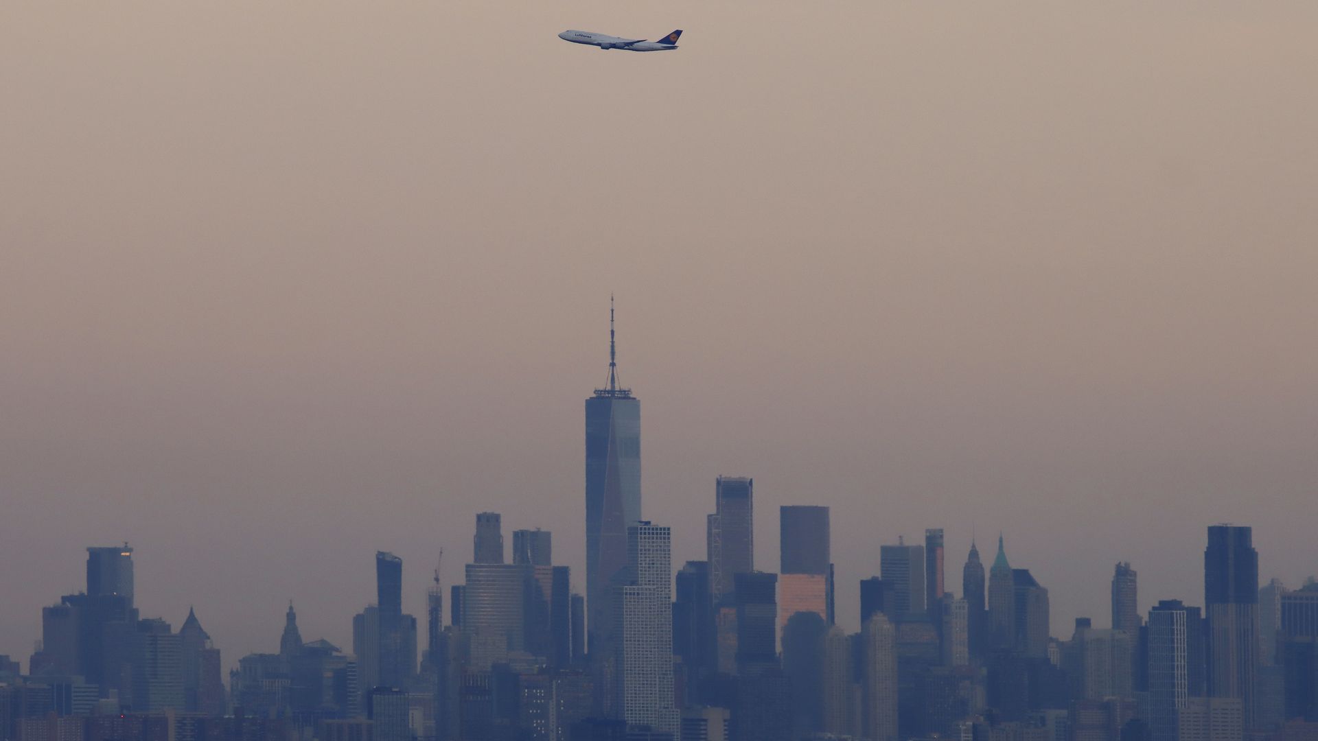An airplane flying over lower Manhattan in New York City on Aug. 11.