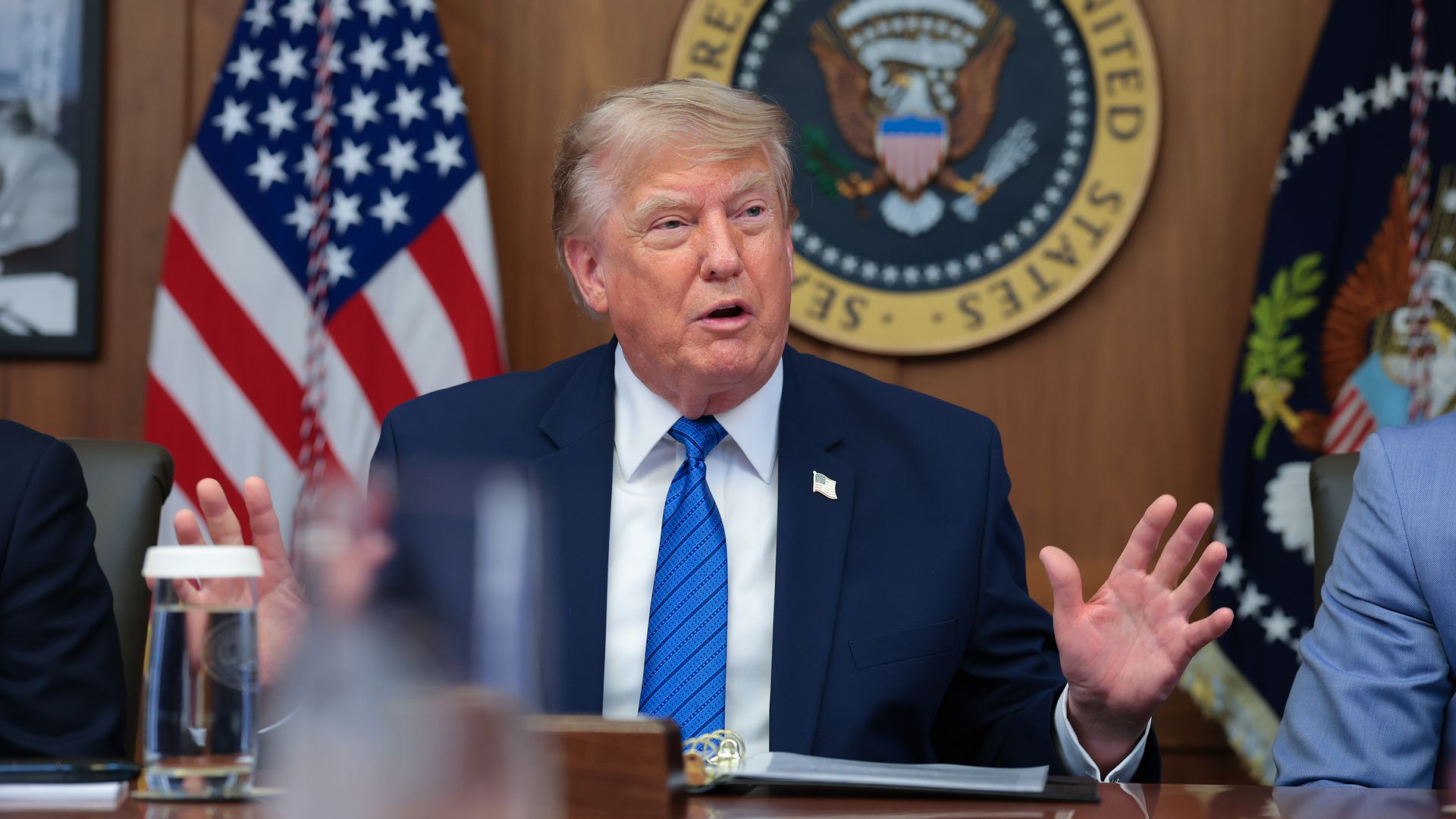 President Donald Trump answers questions from reporters during a Cabinet meeting at Camp David.