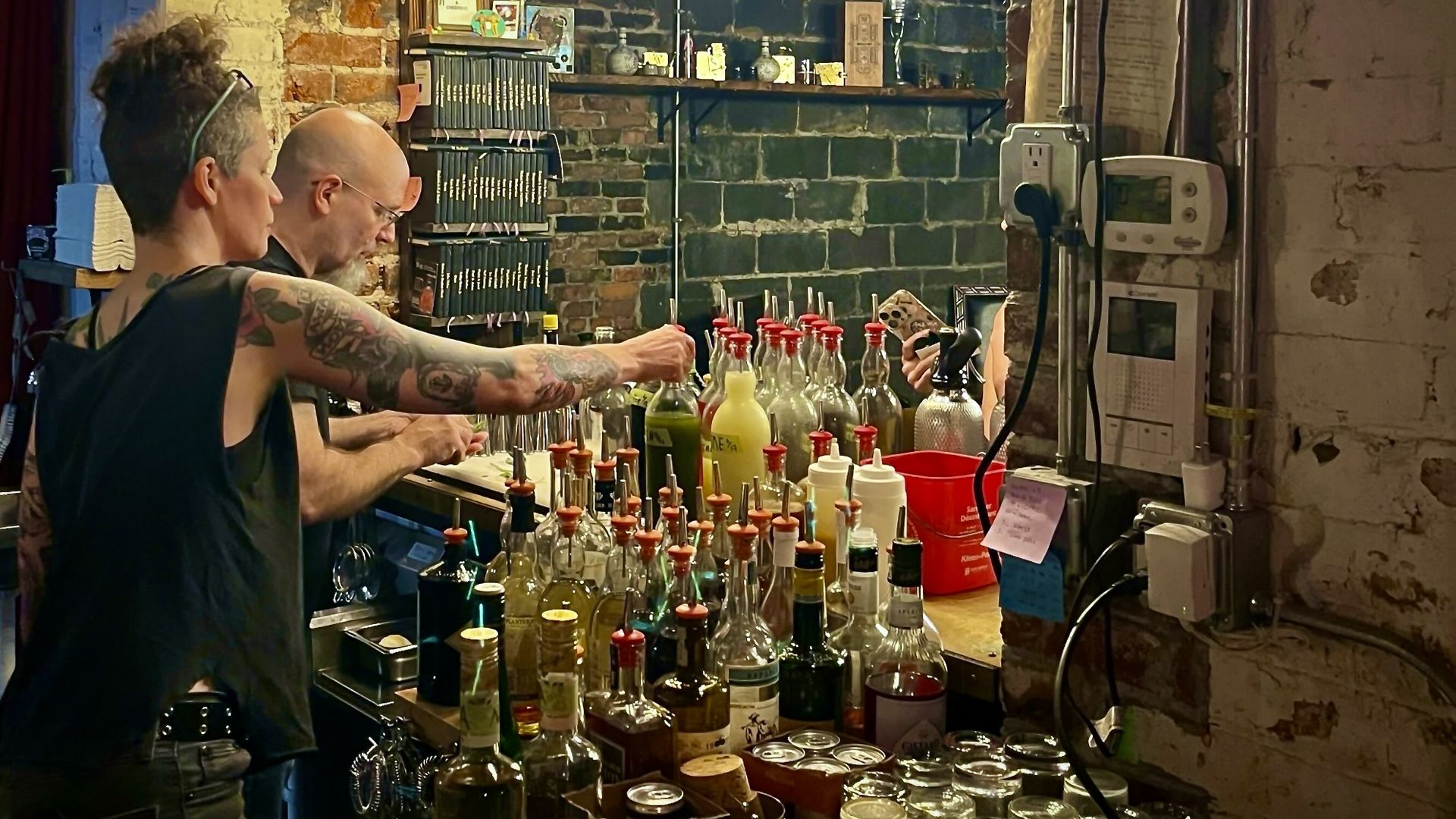 Owner Jill Cockson and bartender Tim Whipple behind the bar.