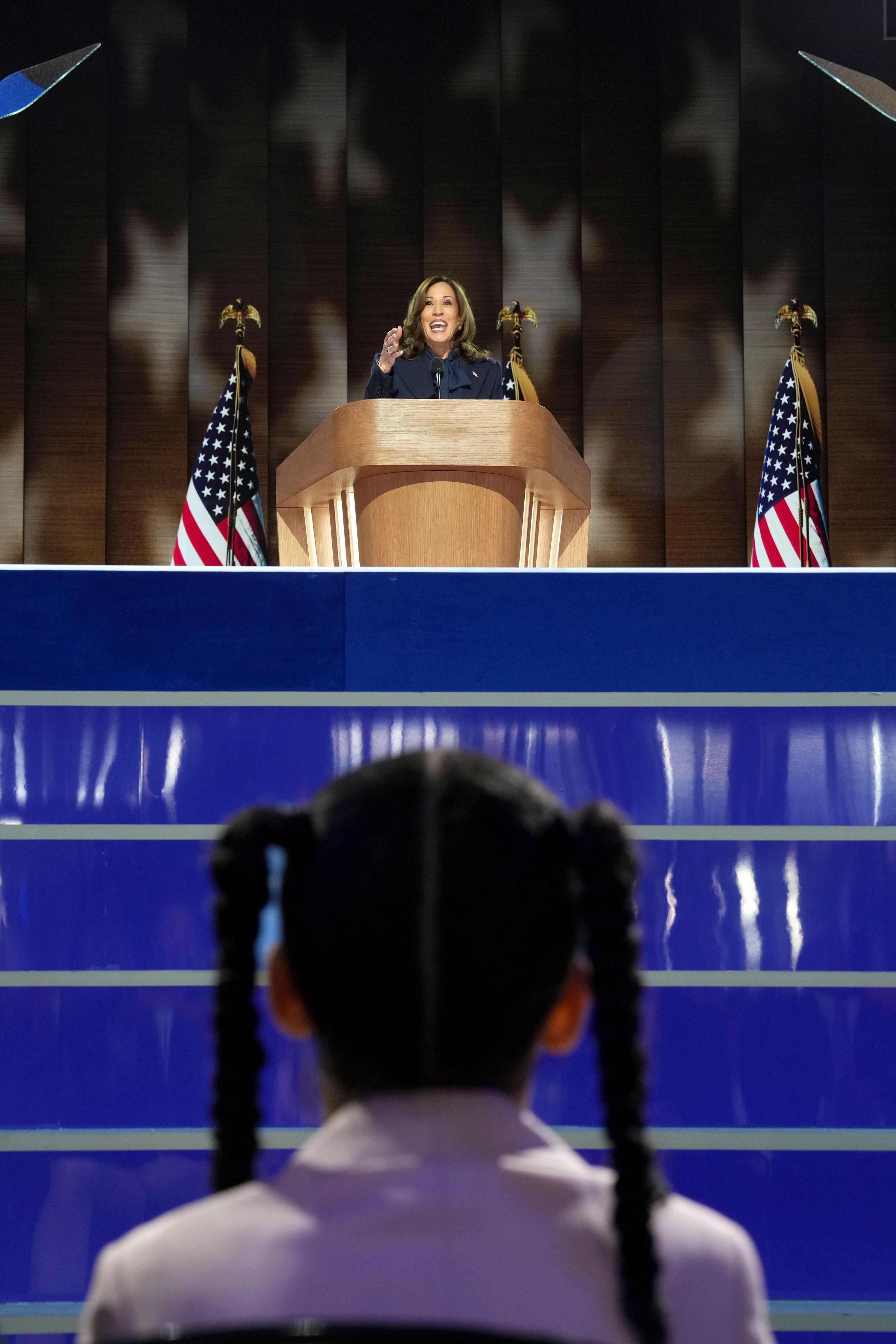. Amara Ajagu watches as Vice President Kamala Harris, the Democratic presidential nominee, speaks on the fourth day of the Democratic National Convention at the United Center in Chicago.