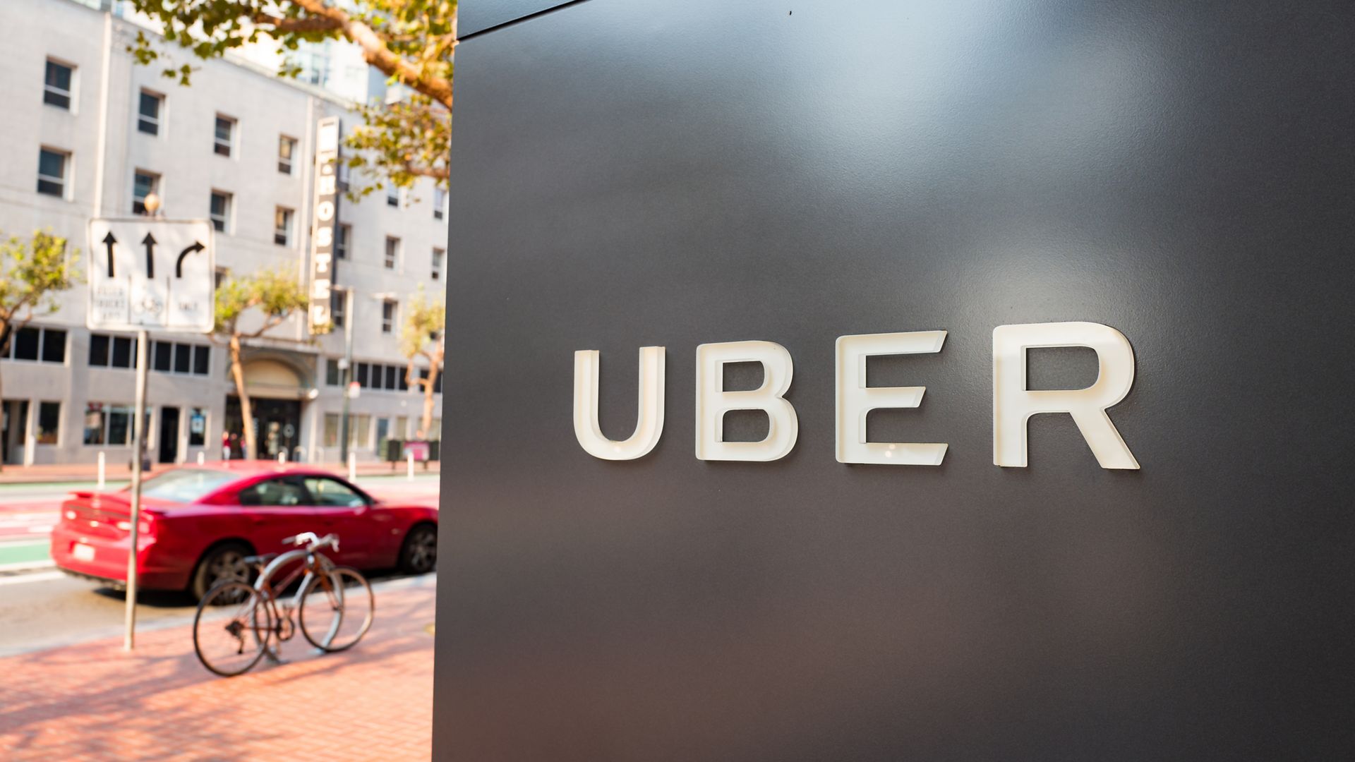 Sign with logo at the headquarters of car-sharing technology company Uber in the South of Market (SoMa) neighborhood of San Francisco, California in 2017.