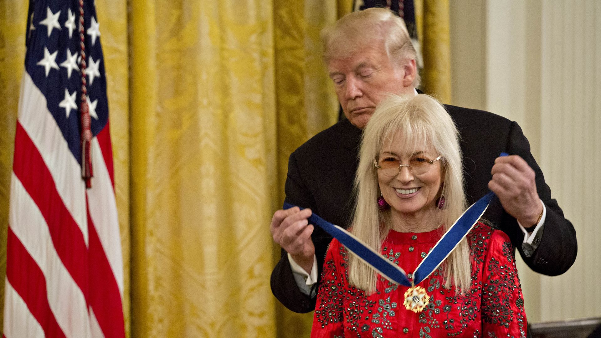 President Trump is seen presenting the Presidential Medal of Freedom to Miriam Adelson in 2015.