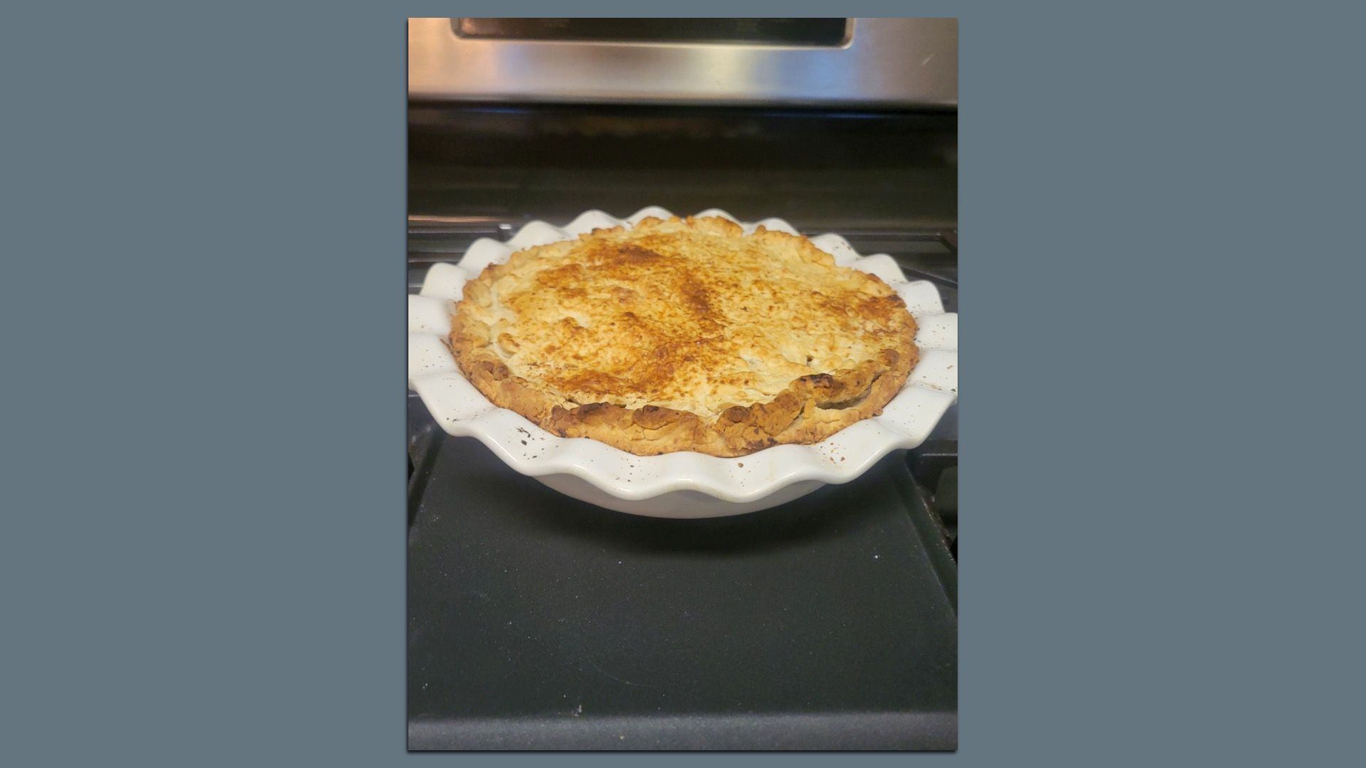 Isaac and Lauren's homemade golden-brown baked pie with a flaky crust.