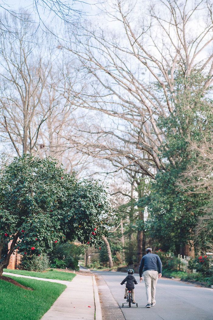 Child learning to ride bike