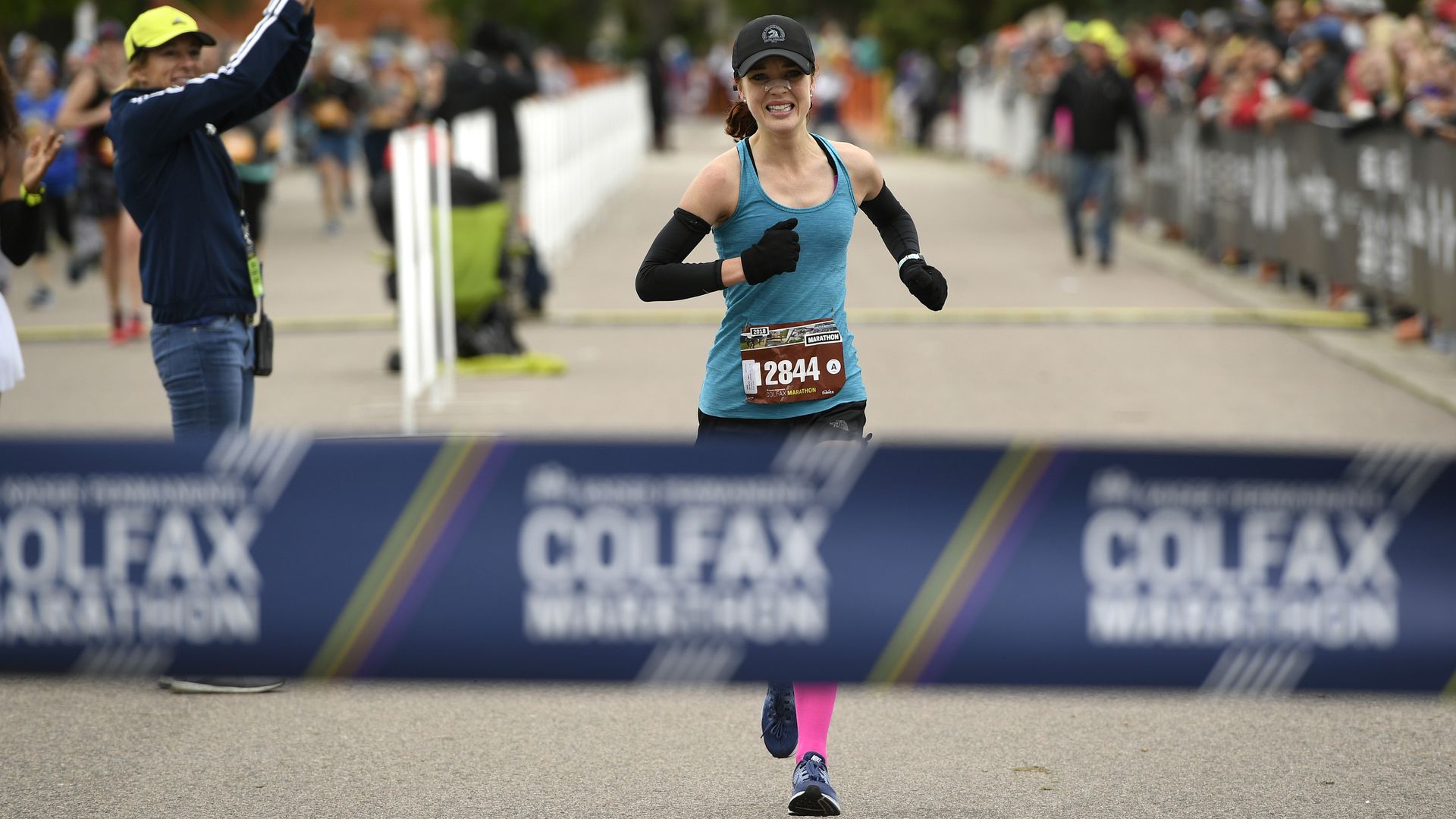Emily Van Meter, 25, of Colorado Springs, heads towards the finish line to win the women's Colfax marathon in a time of 2:56:51 in City Park on May 20, 2018 in Denver, Colorado.